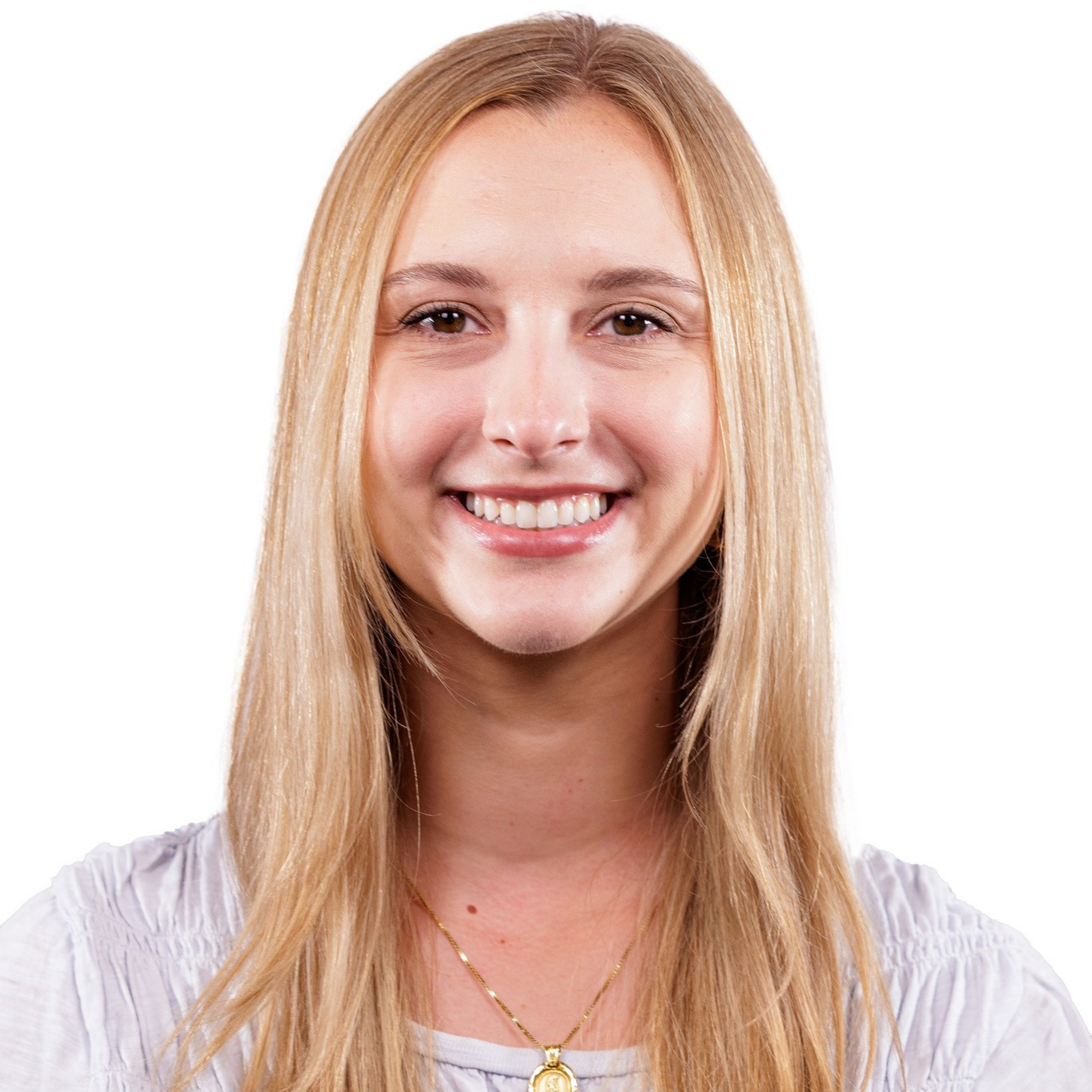 A young woman with long, straight blonde hair smiles, wearing a light-colored blouse and a gold pendant necklace.