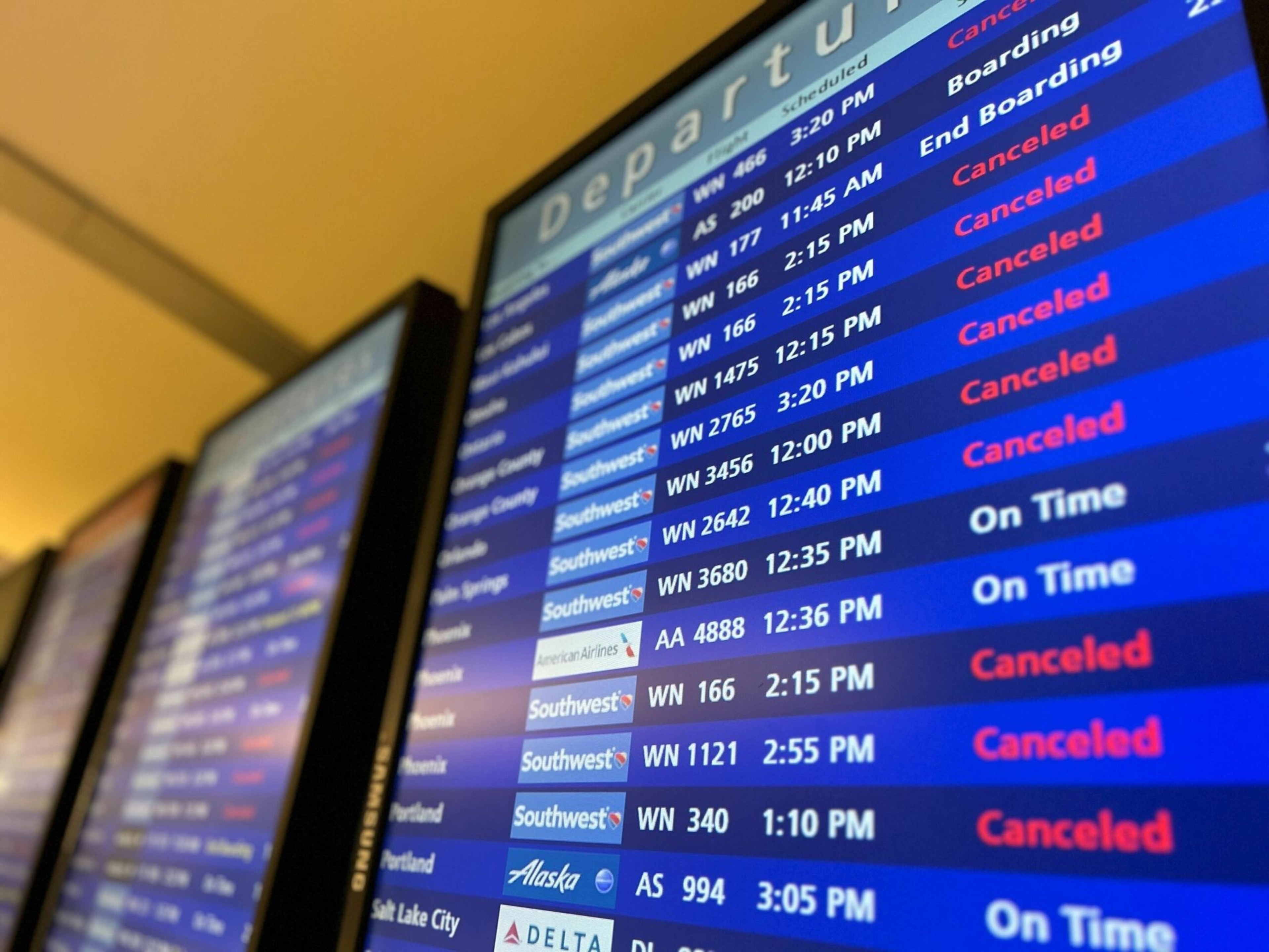 Flights to multiple destinations are shown, many Southwest flights are marked "Canceled" in red, while a few are "On Time" or "Boarding."