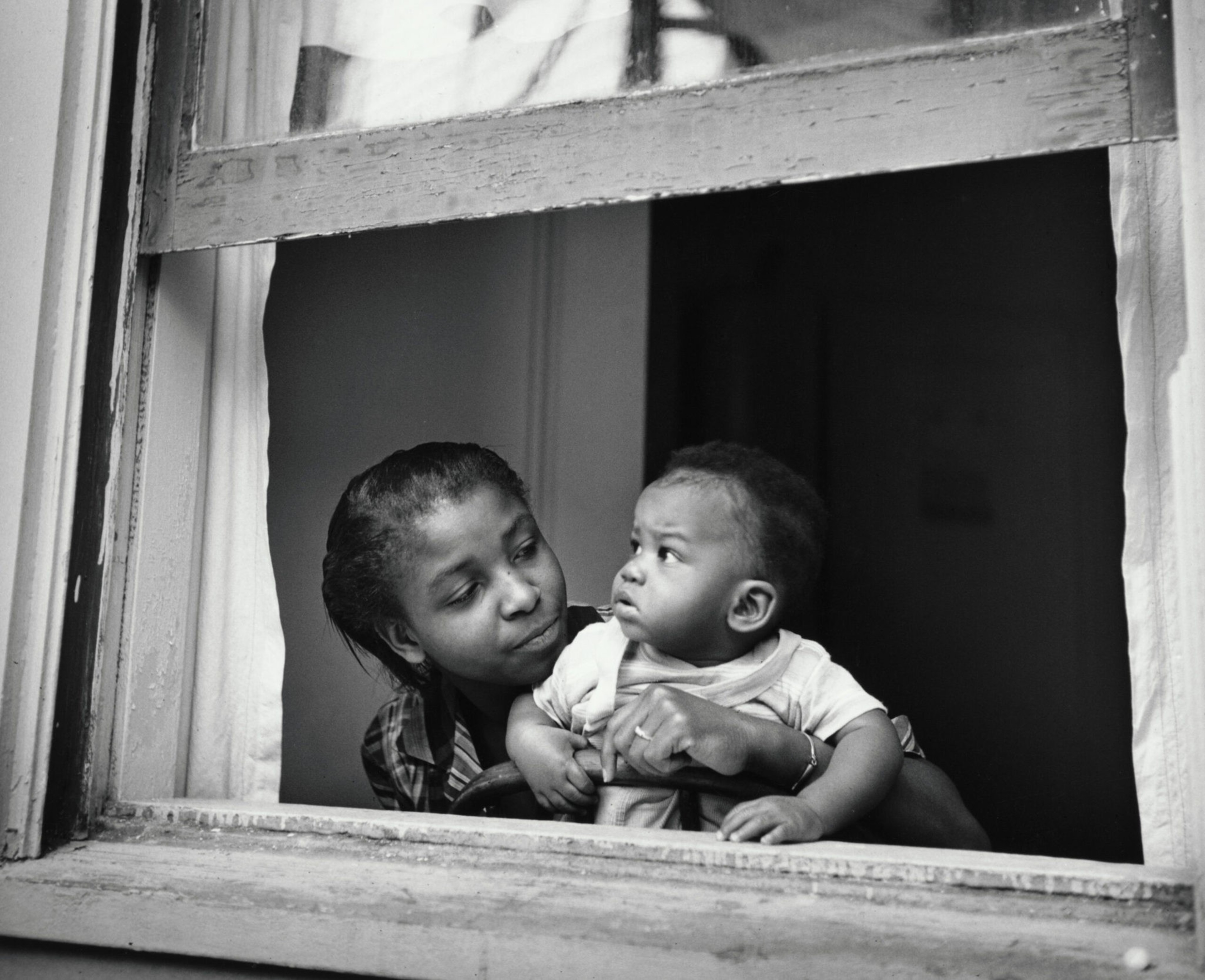 woman and baby in a window