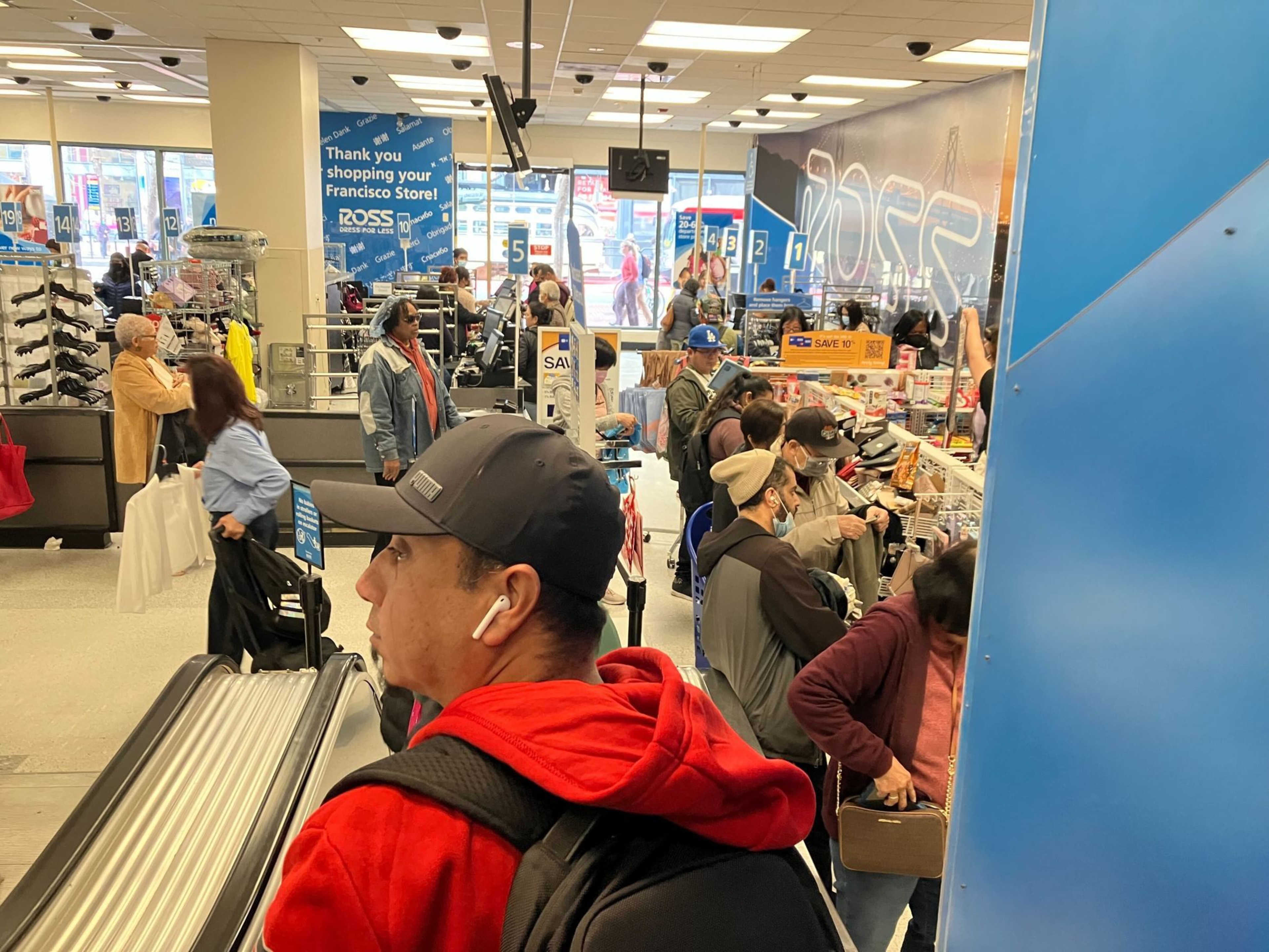 Oswaldo Zaragoza, of Castro Valley rides the escalator to check out and pay for goods at the Downtown San Francisco Ross Dress for Less.