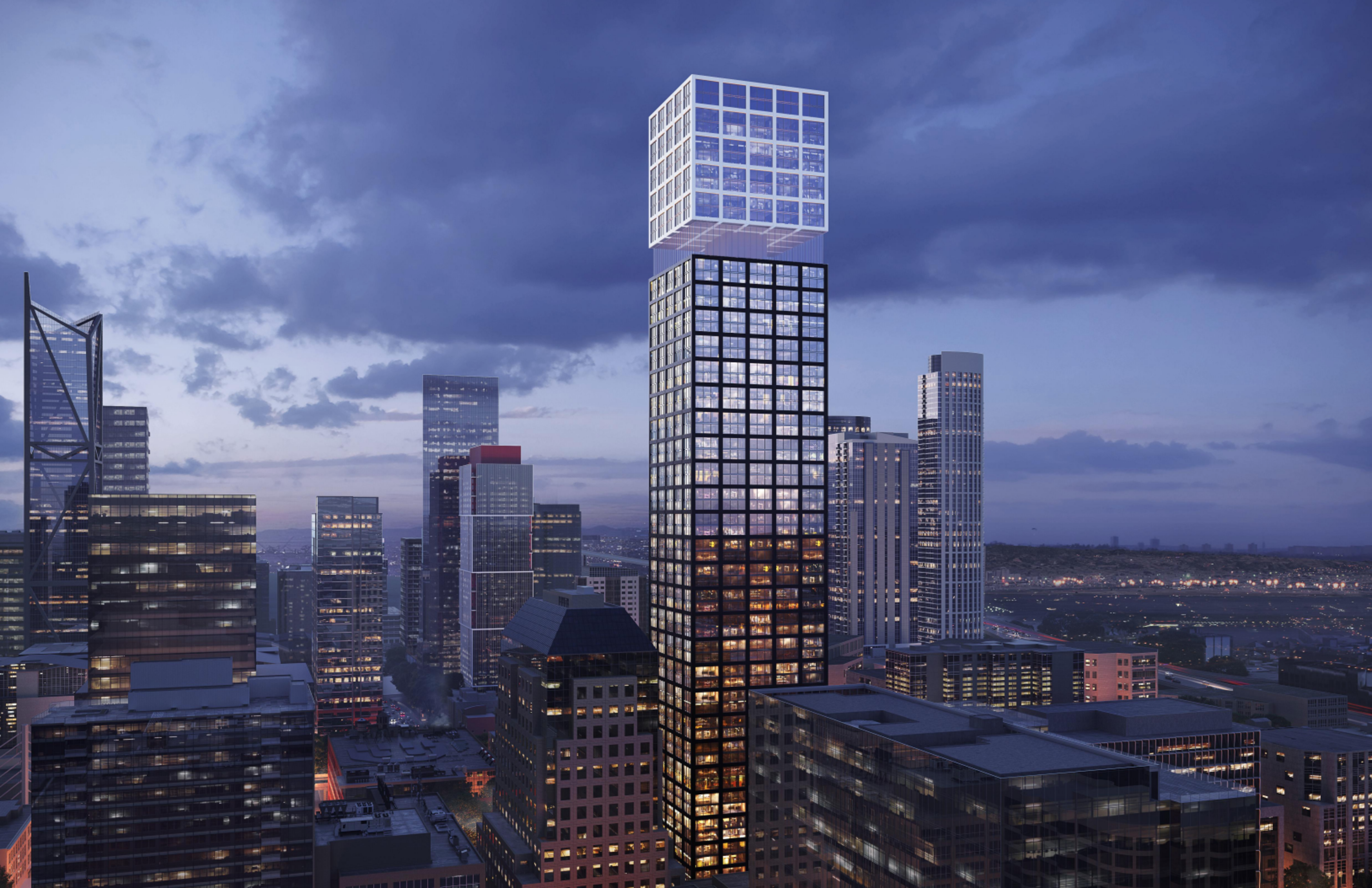A city skyline at dusk features a unique skyscraper with a large, illuminated cube perched on top of a tall, rectangular building.