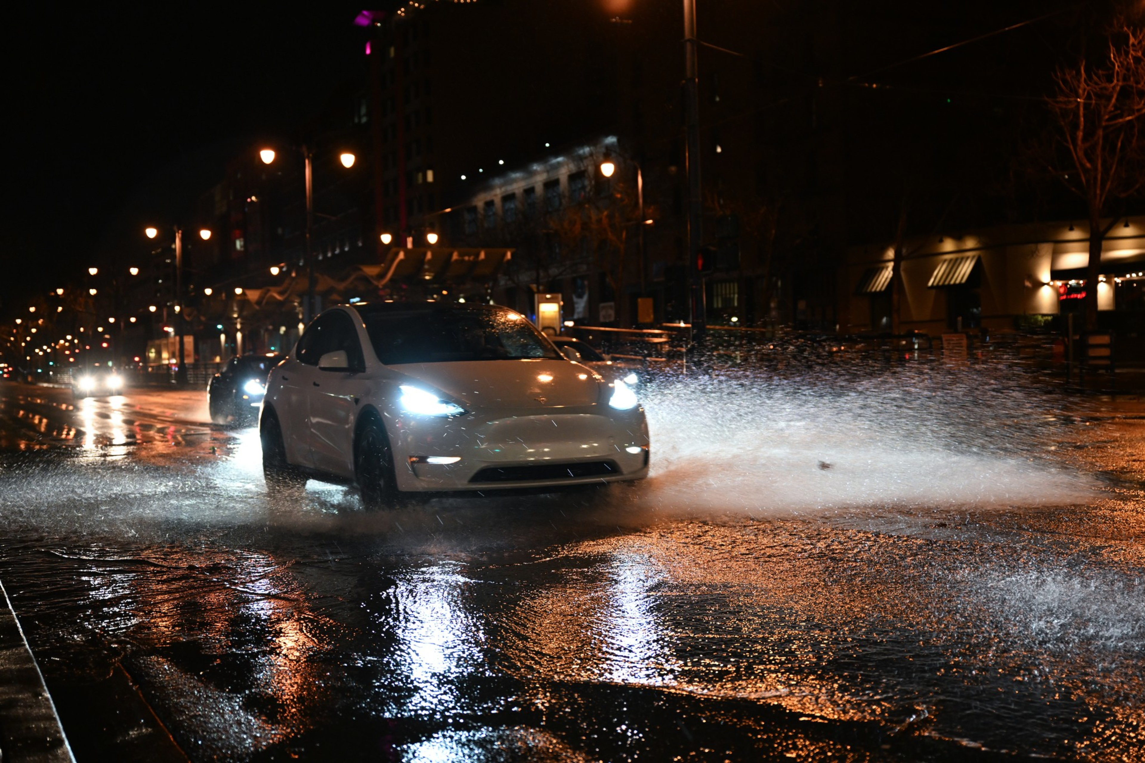 CALIFORNIA, USA - FEBRUARY 04: Cars pass through a flood on Embarcadero in San Francisco, as atmospheric river storms hit California, United States on February 04, 2024. (Photo by Tayfun Coskun/Anadolu via Getty Images)