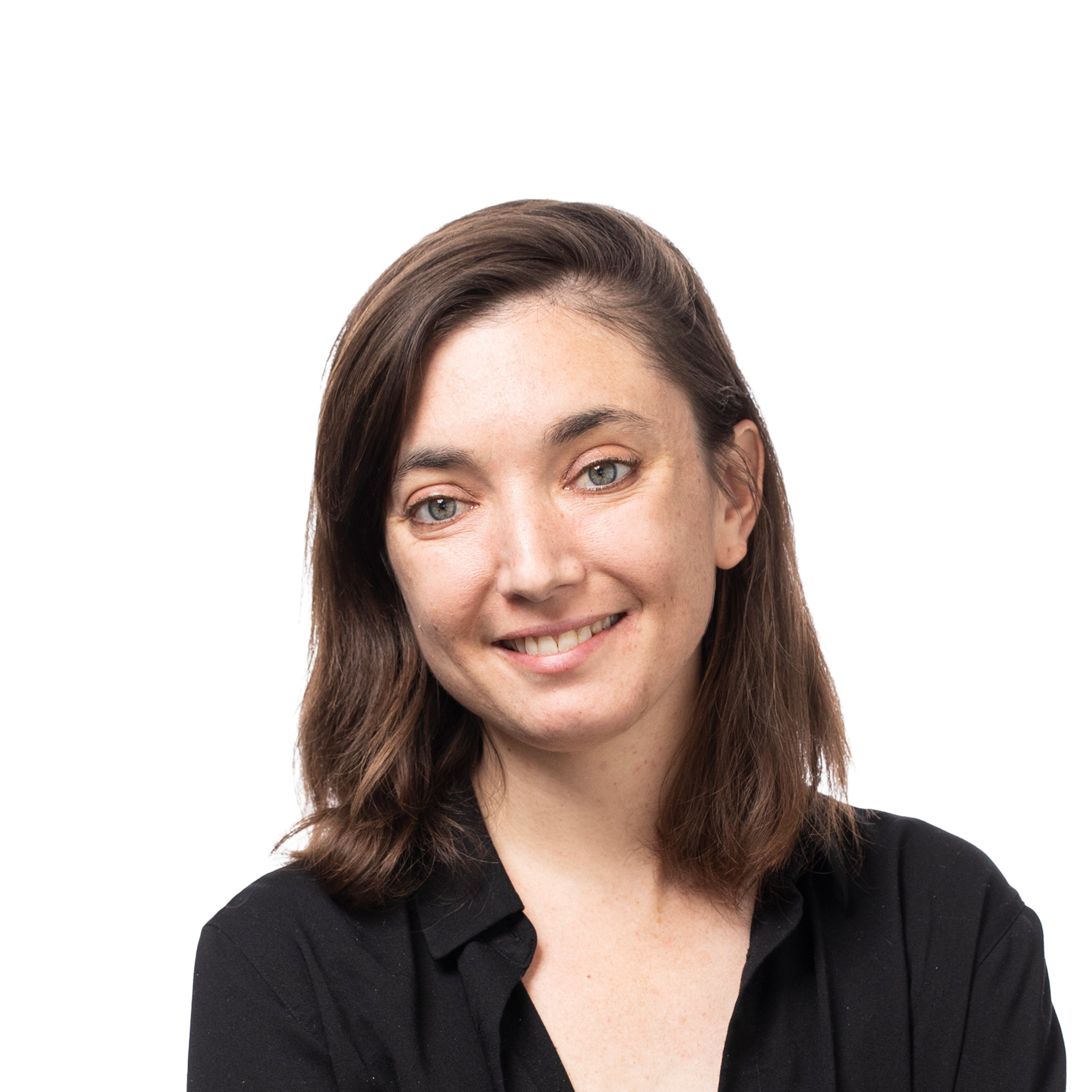 A woman with shoulder-length brown hair and light skin smiles gently, wearing a black shirt against a plain background.