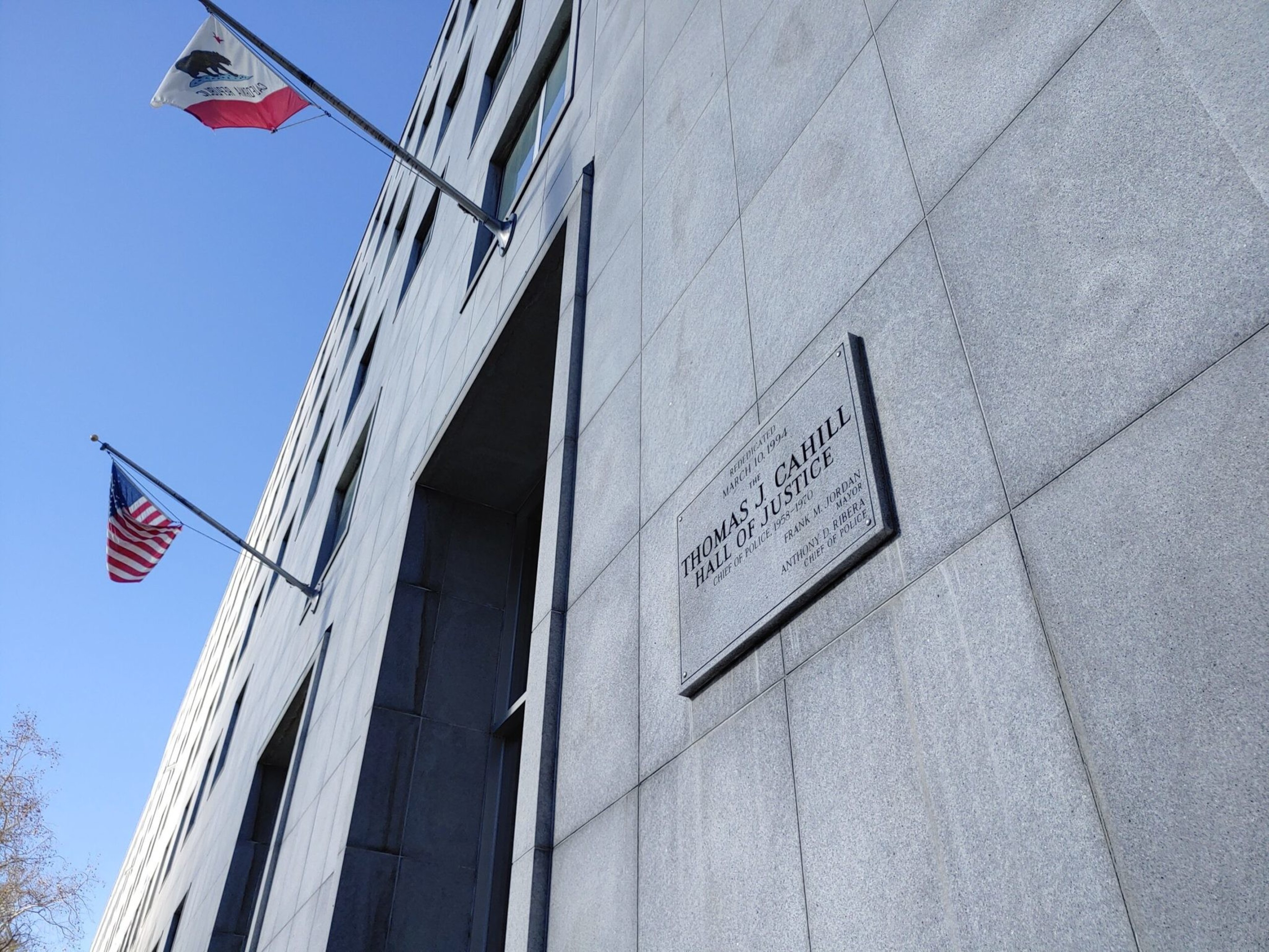 The outside of a courthouse is seen in a photo.