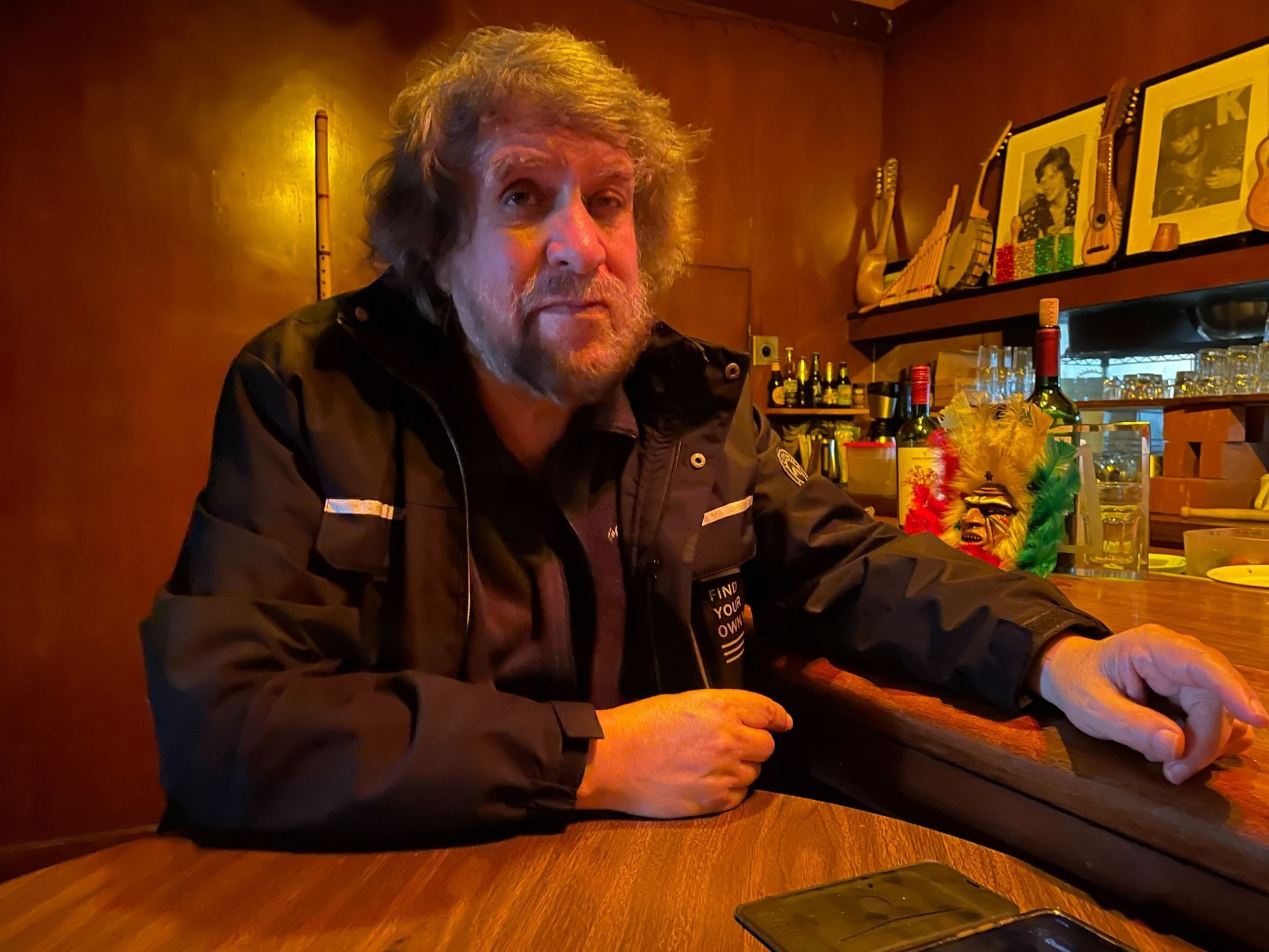 A man sits at a table.