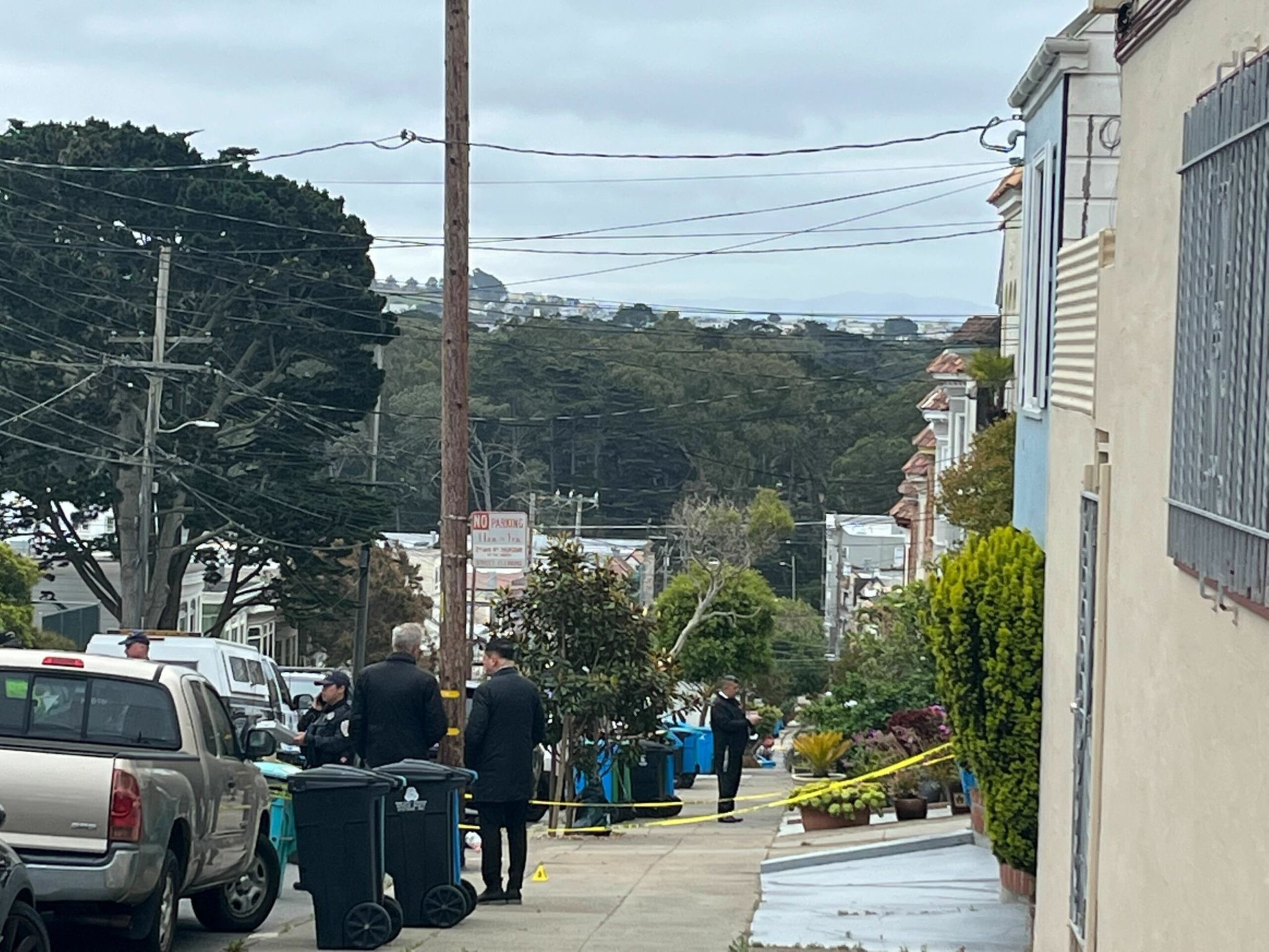 San Francisco police officers gather outside a home on 31st Avenue in the Richmond neighborhood after an officer shot a person in the early hours of June 2, 2023. | Ida Mojadad/The Standard