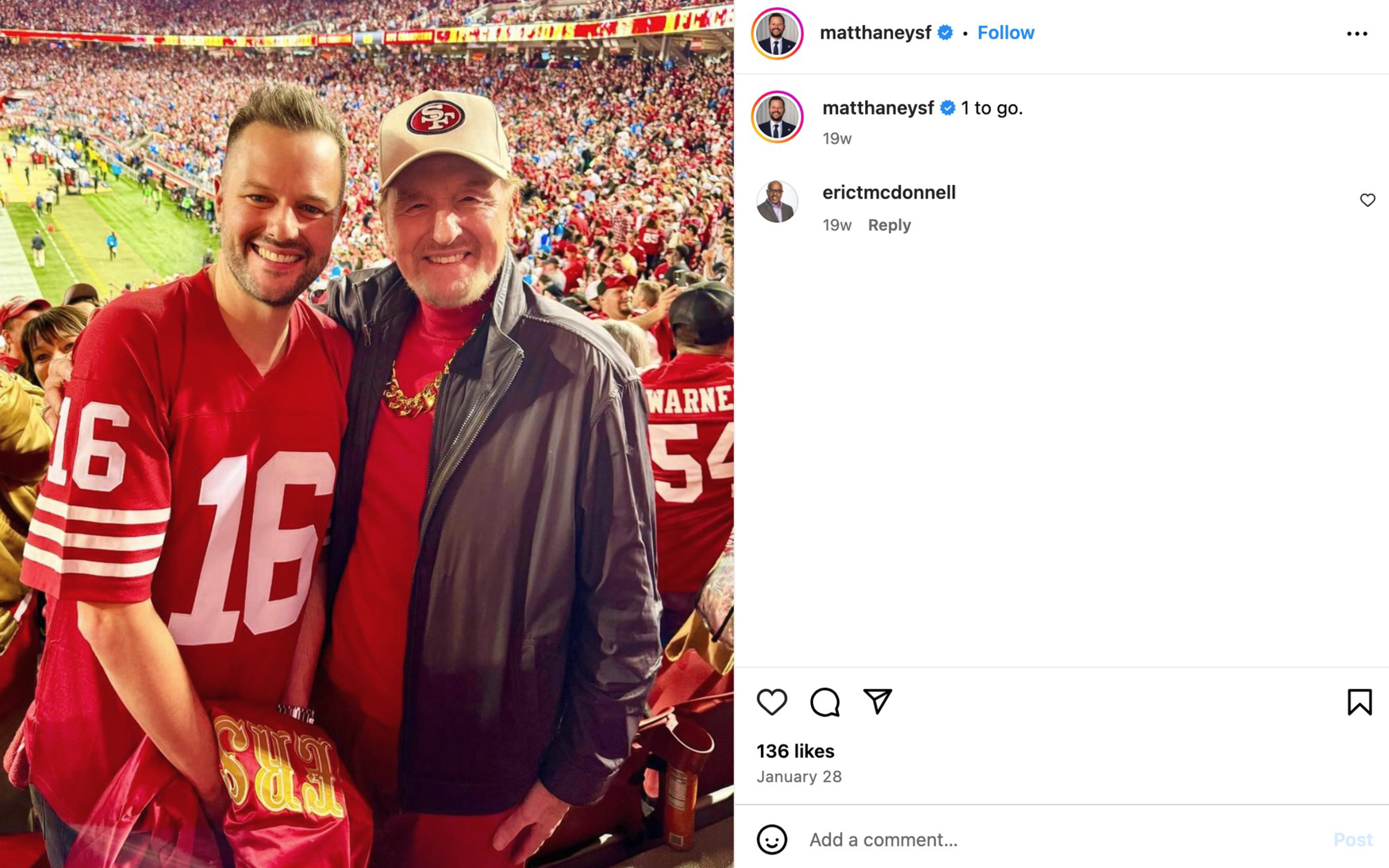 Matt Haney and his dad, Craig, in red jerseys, with the number "16" visible on one, stand in a crowded football stadium filled with fans wearing red.