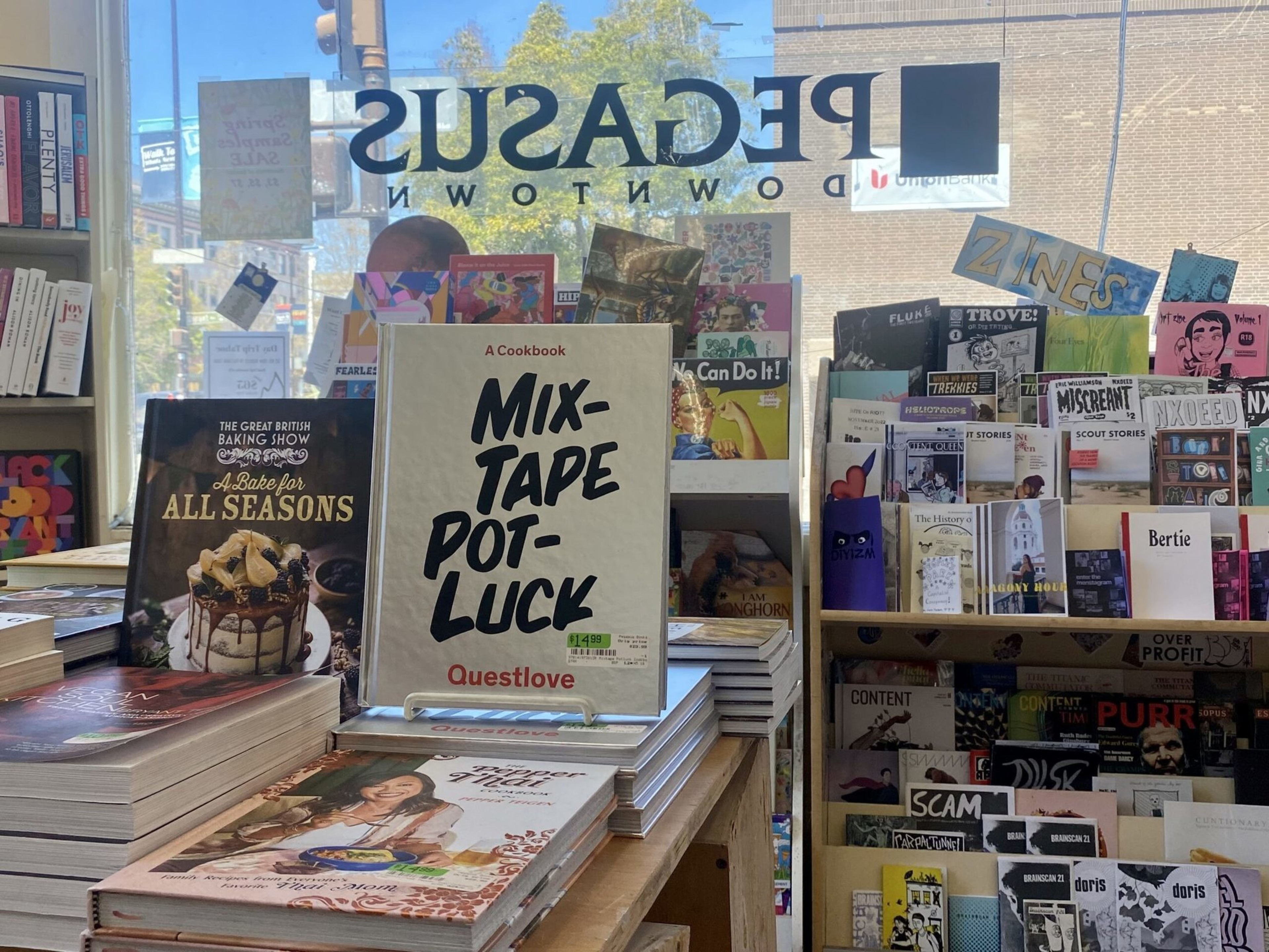Displays of books inside a storefront at Pegasus Books. 