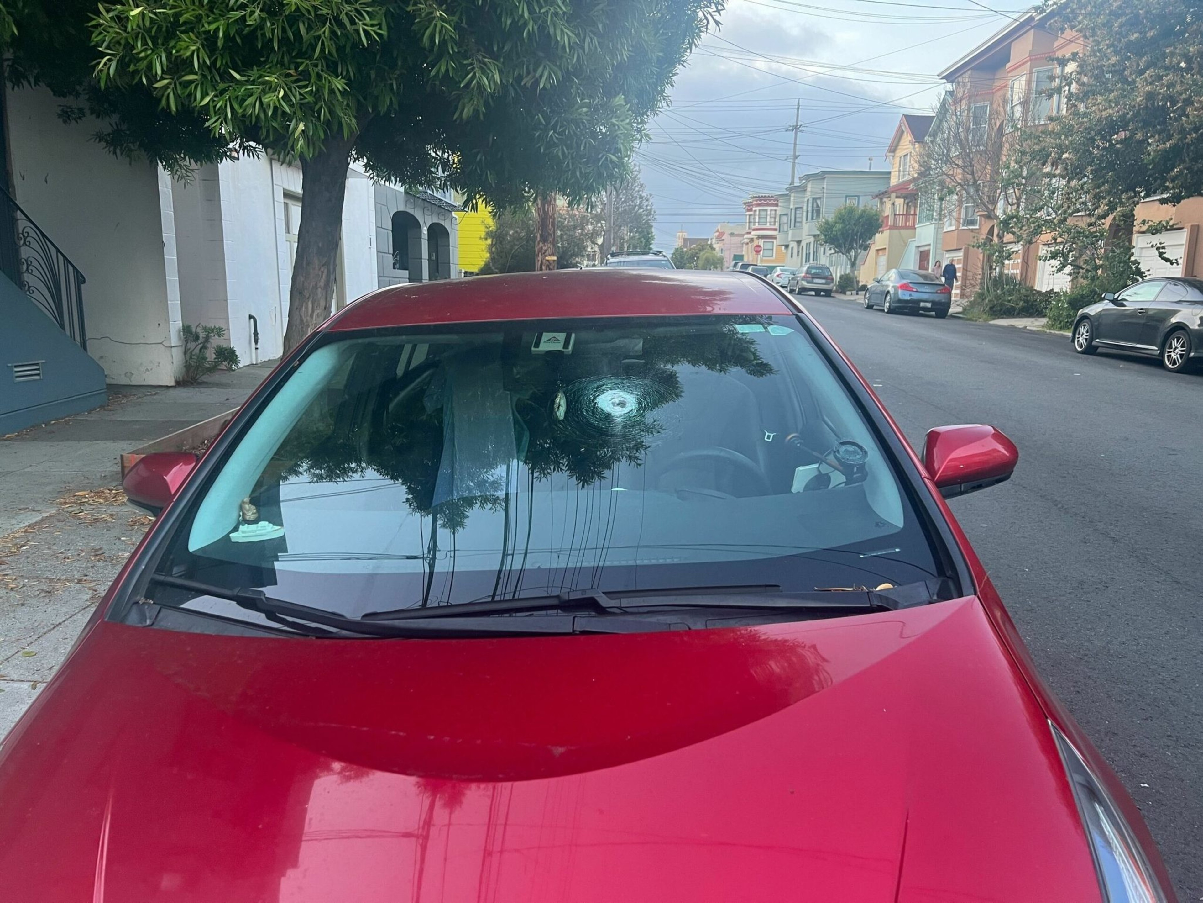 A bullet hole is seen in a parked car on Alabama Street after the latest shooting rocked San Francisco's Mission District. | Julie Zigoris/The Standard