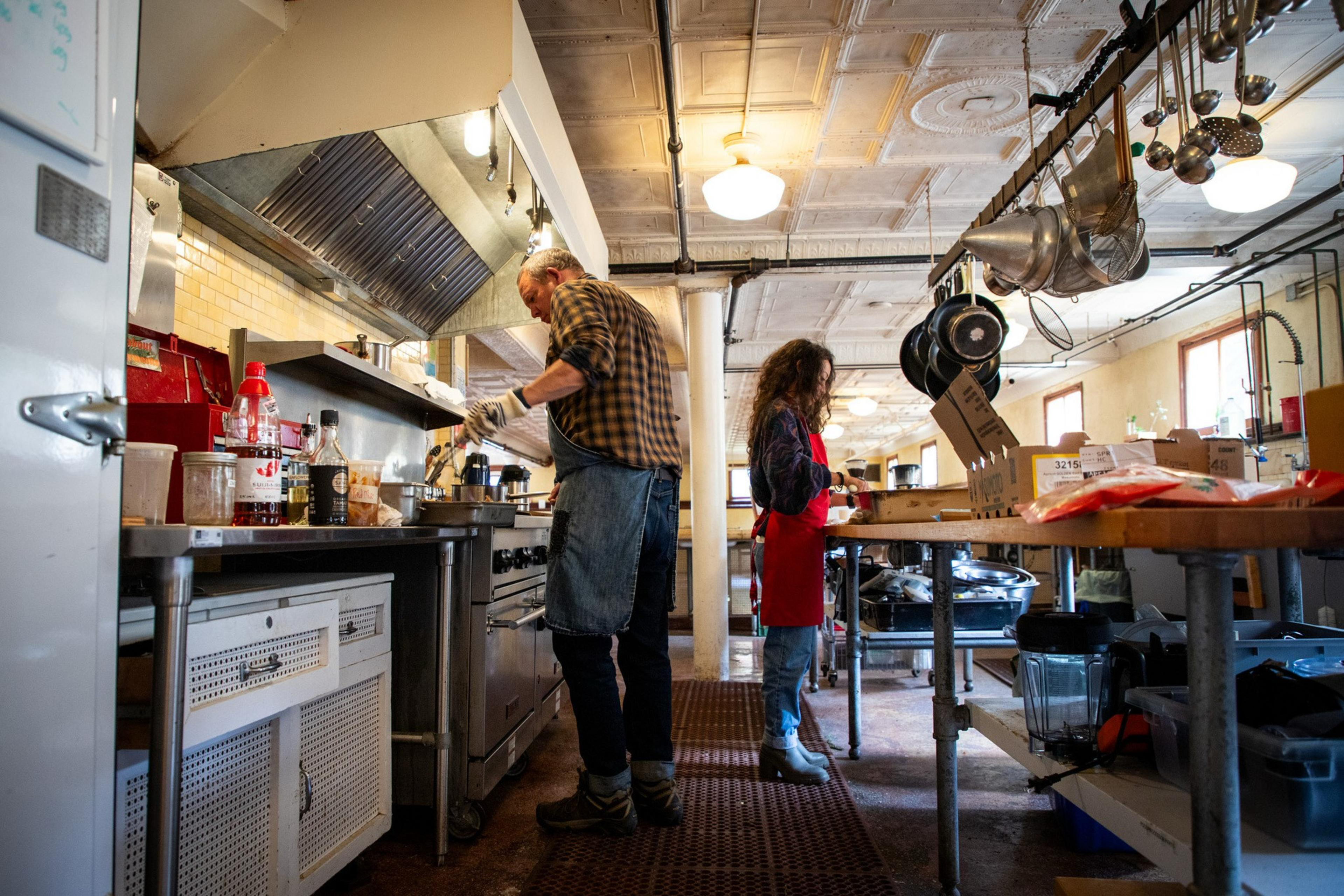 9335565168_MarinHeadlandsCenterArts_FZ_029 Staff prepare a meal inside the kitchen at the Headlands Center for the Arts on Wednesday, June 25.