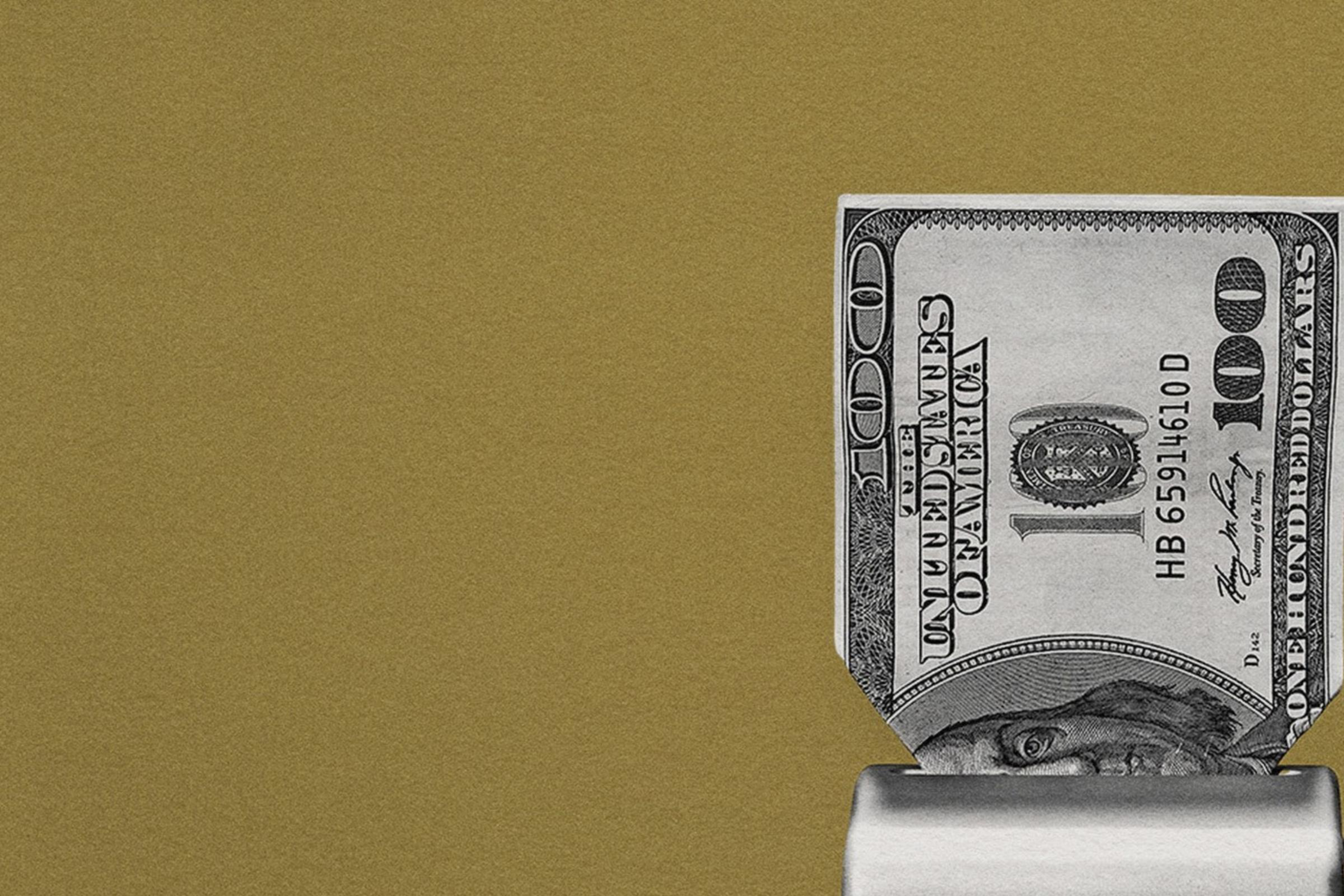 A one hundred dollar bill getting shredded