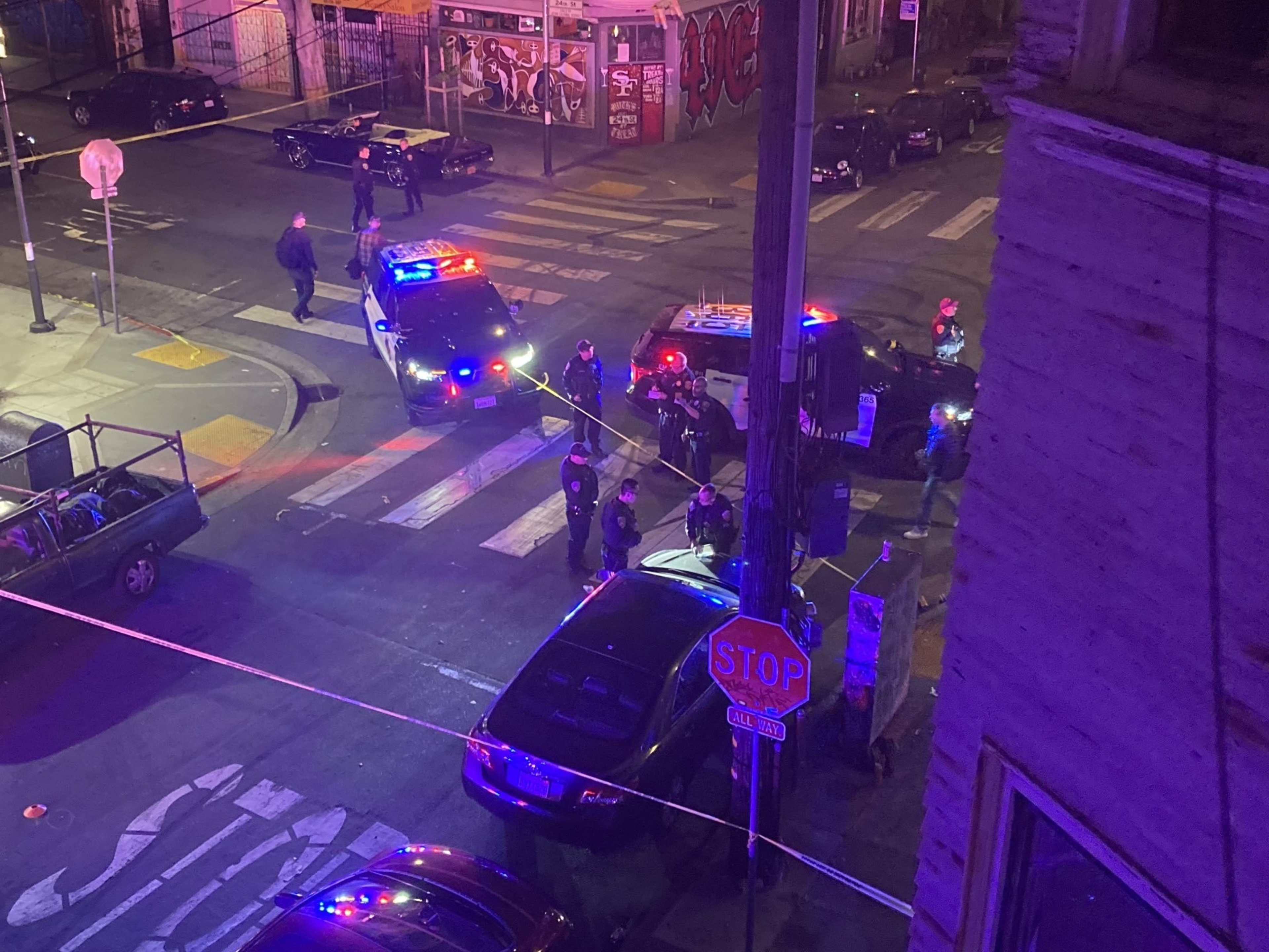 police cars block an intersection
