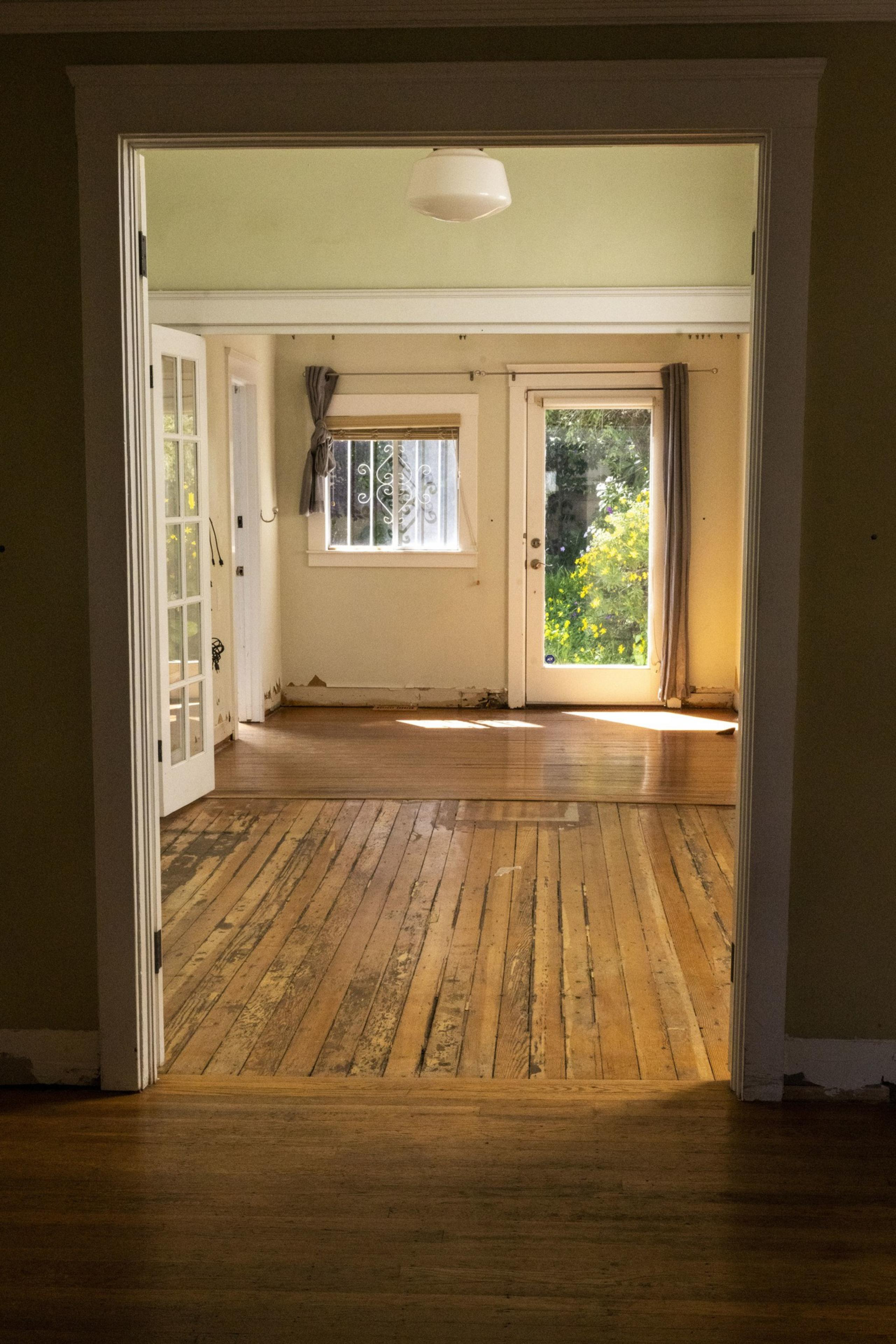 Two rooms of a Victorian home in the Castro with flooding damage.