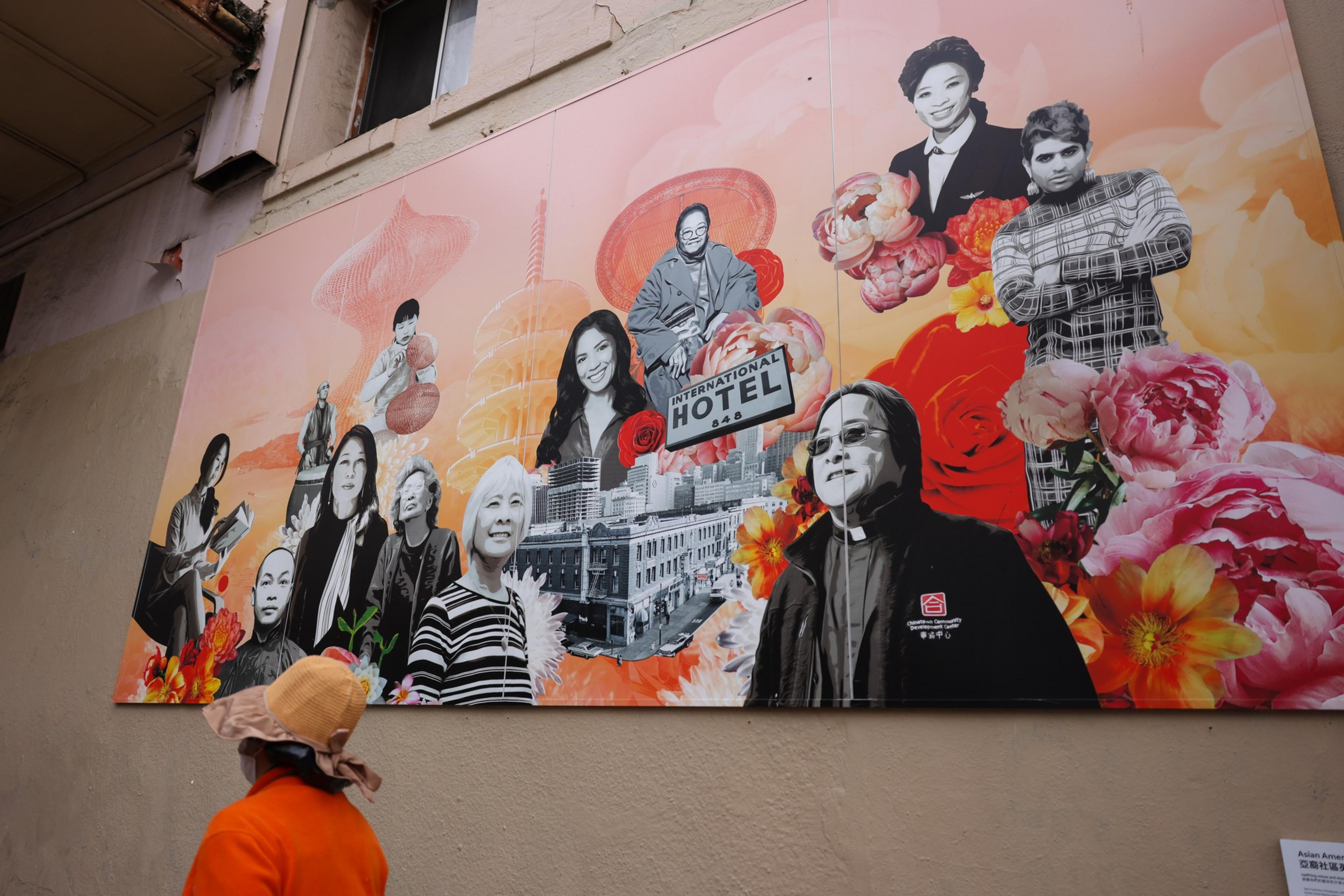 Mural of a dozen people painted on a building exterior