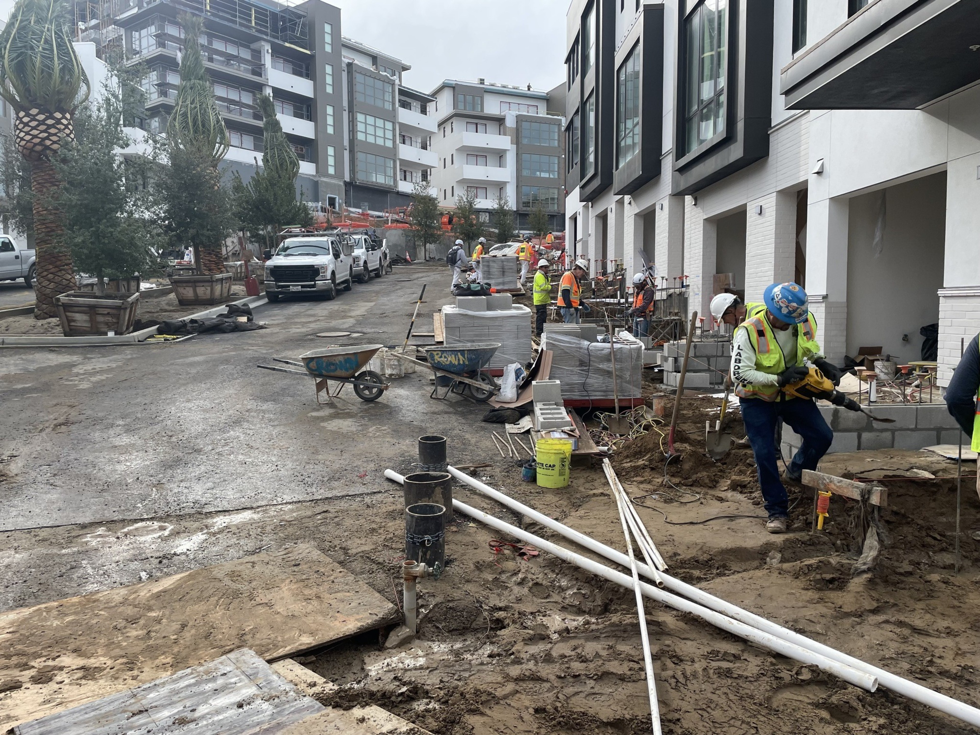 Construction workers build condos.