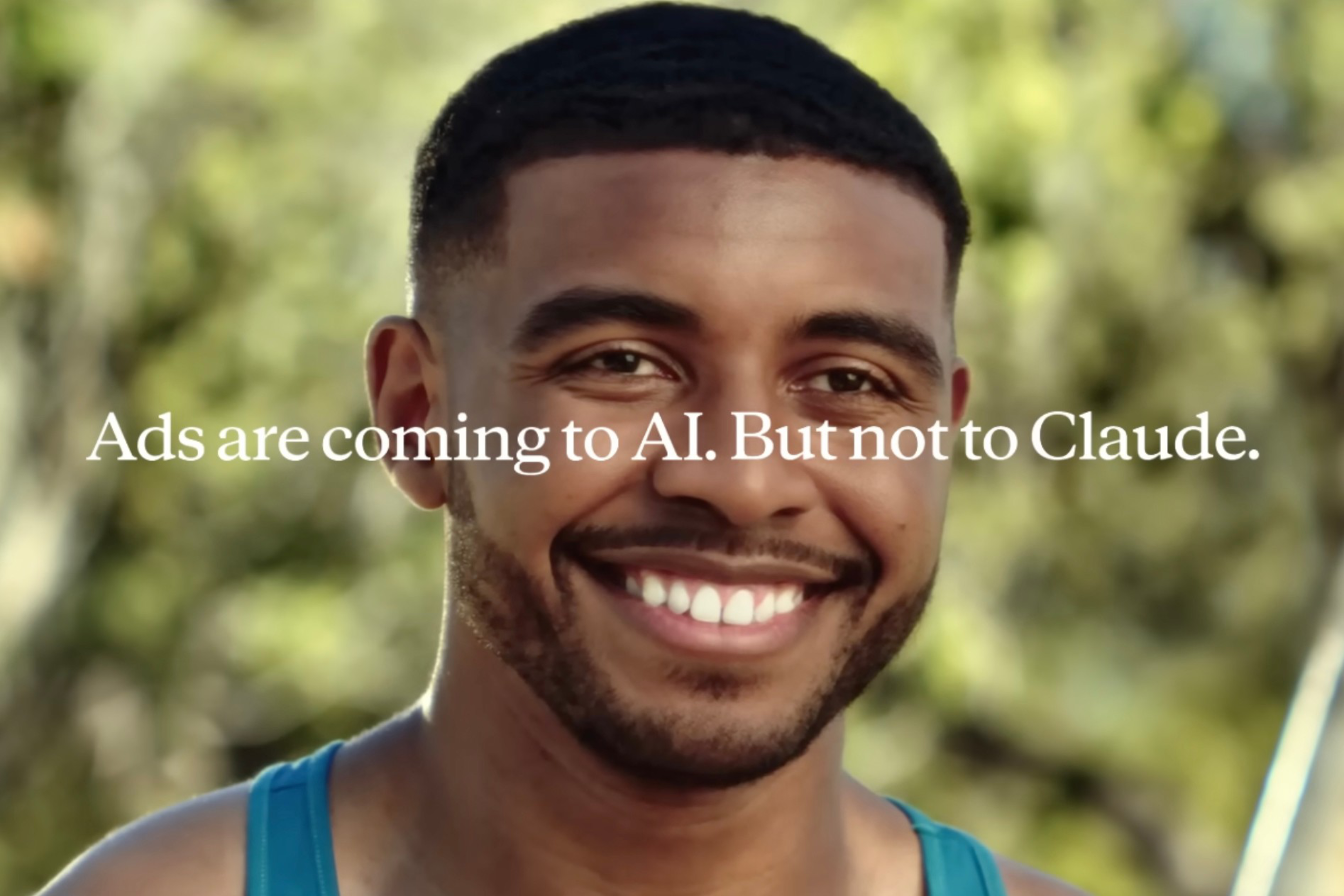 A smiling man with short black hair and a beard is in a blurred outdoor setting, with the text "Ads are coming to AI. But not to Claude." across the image.