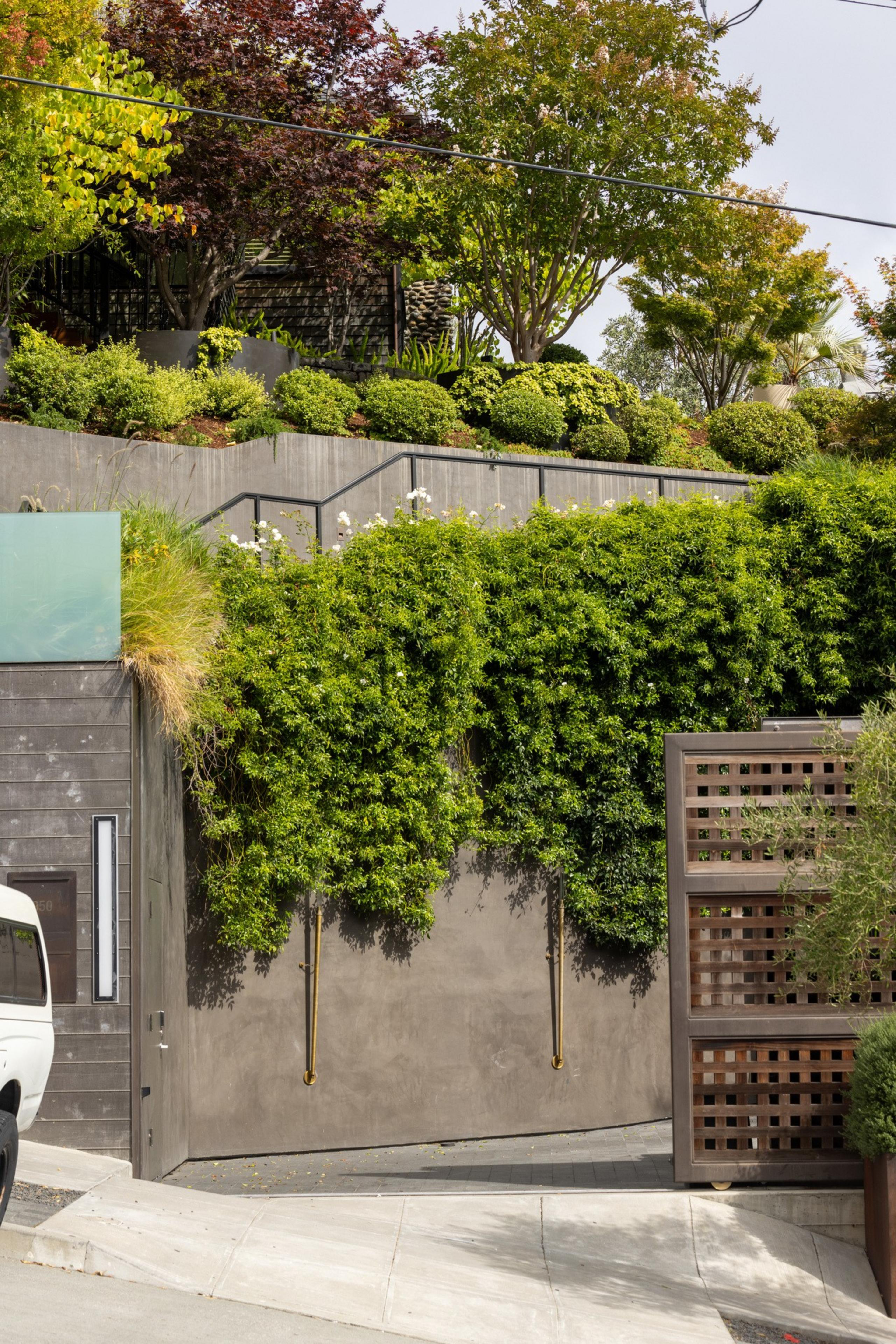 The retaining wall and entrance of a mansion.