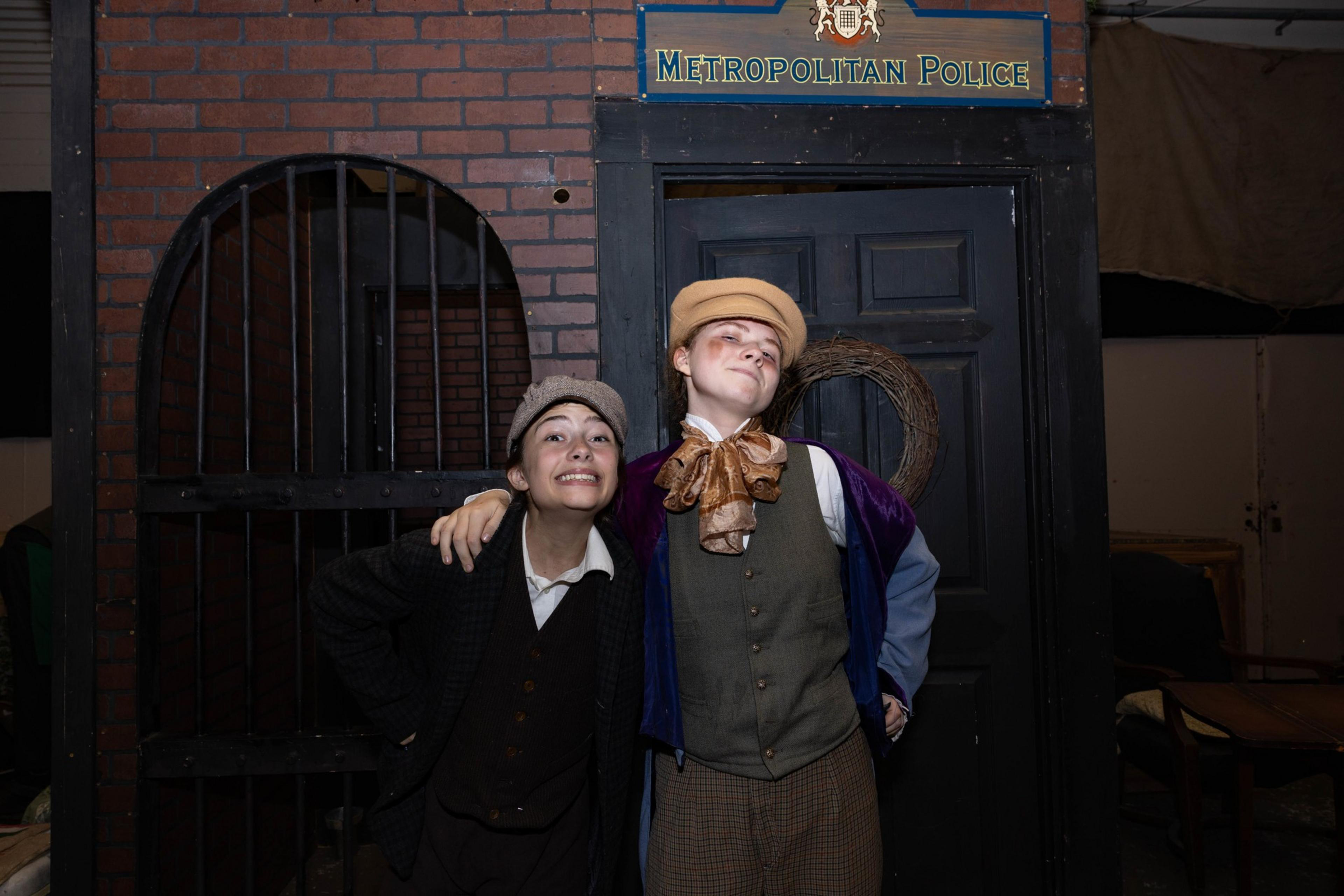 Two actors in Victorian Era garb.