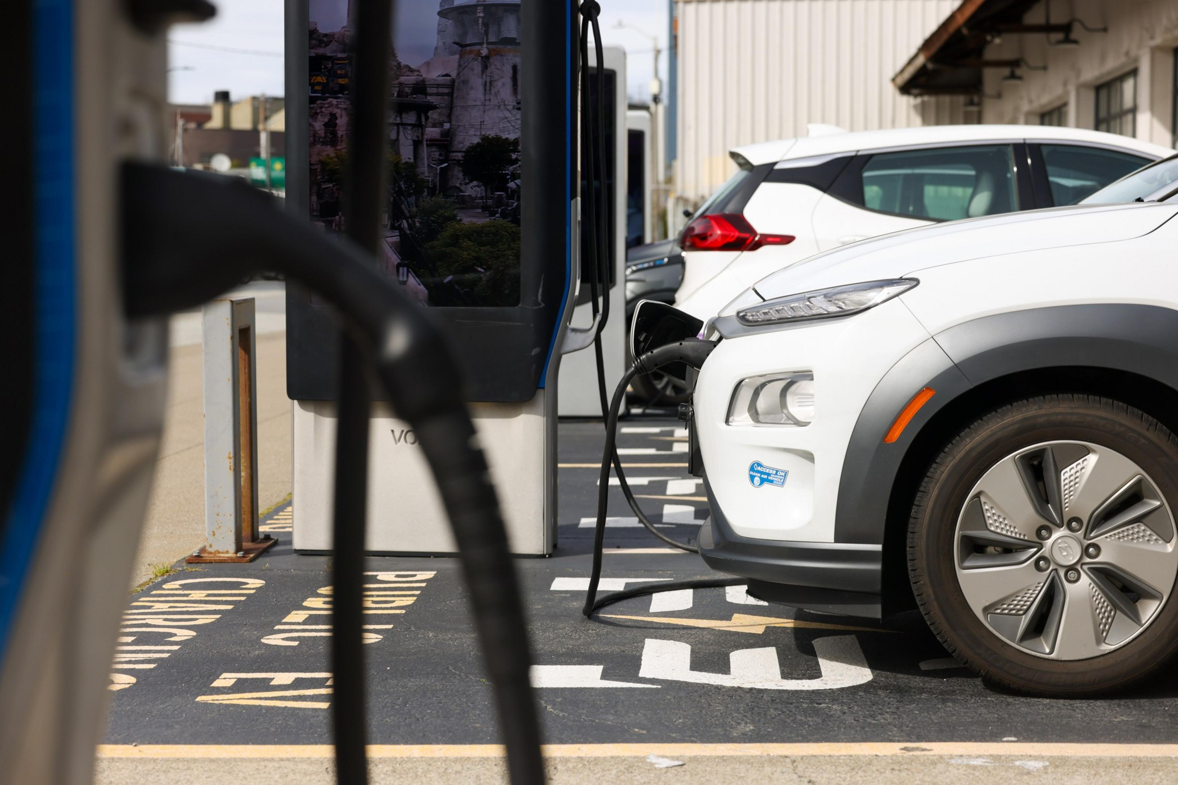 An electric car is plugged into a charging station.