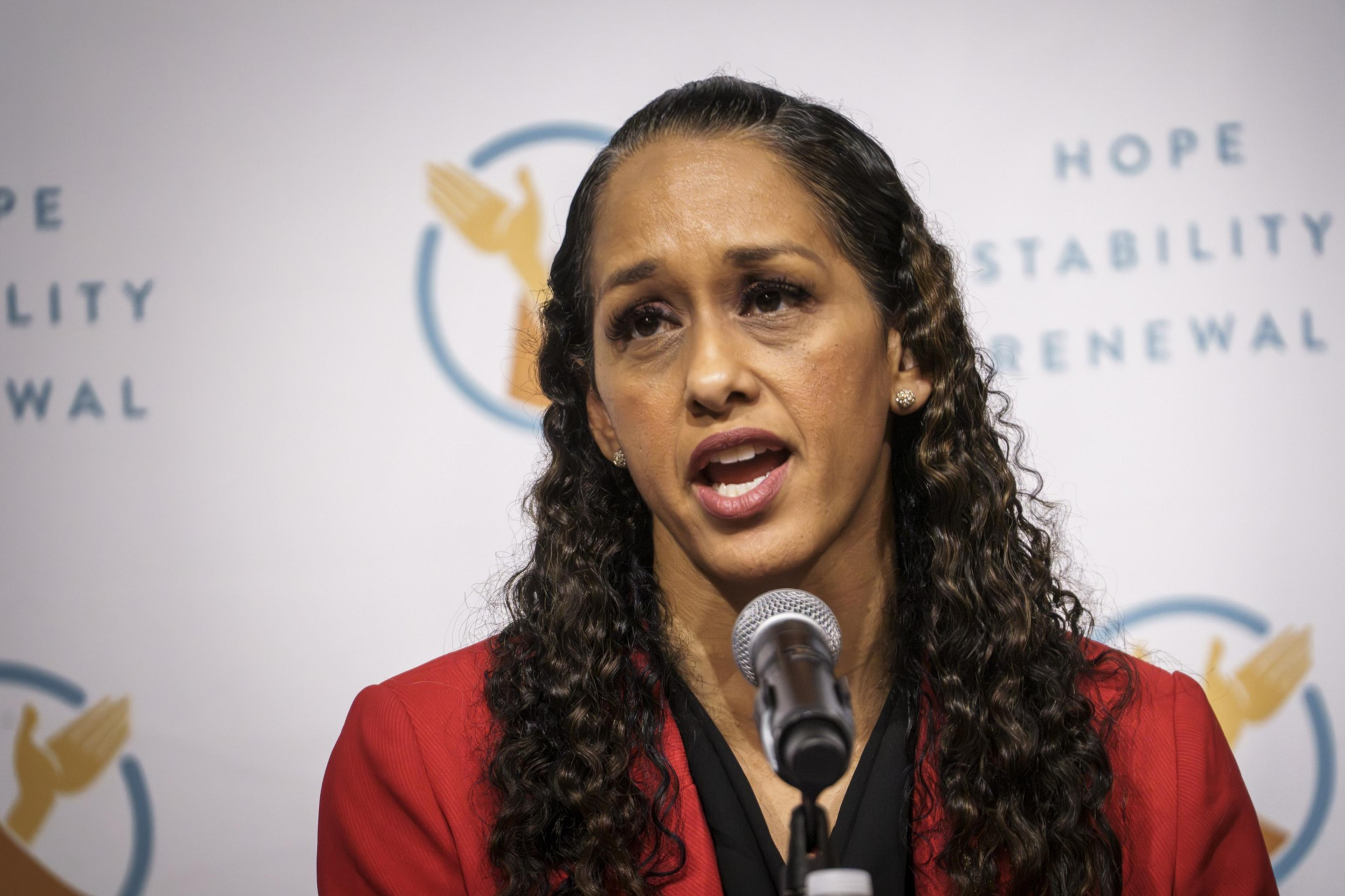San Francisco District Attorney Brooke Jenkins speaks into a microphone.
