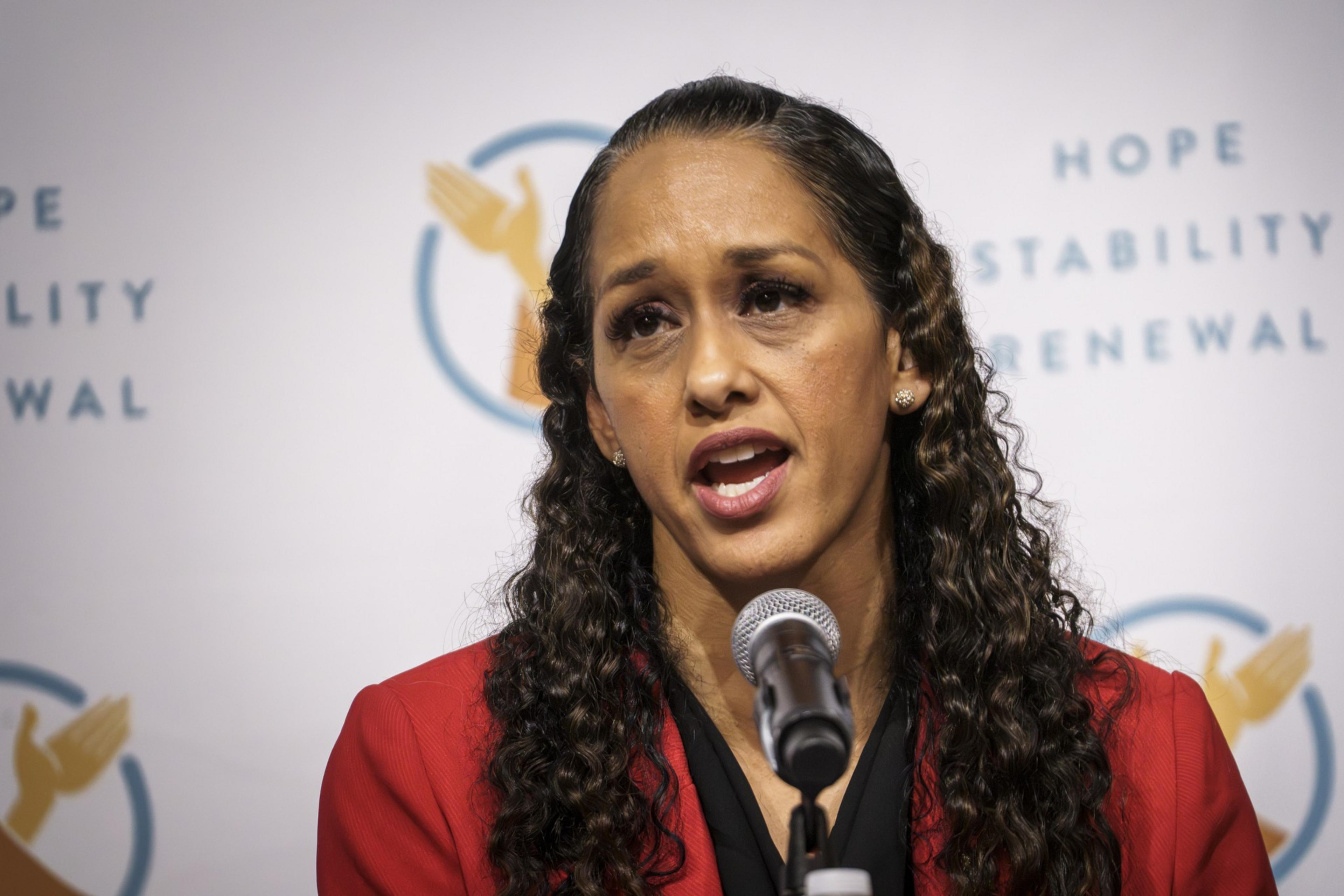 San Francisco District Attorney Brooke Jenkins speaks into a microphone.