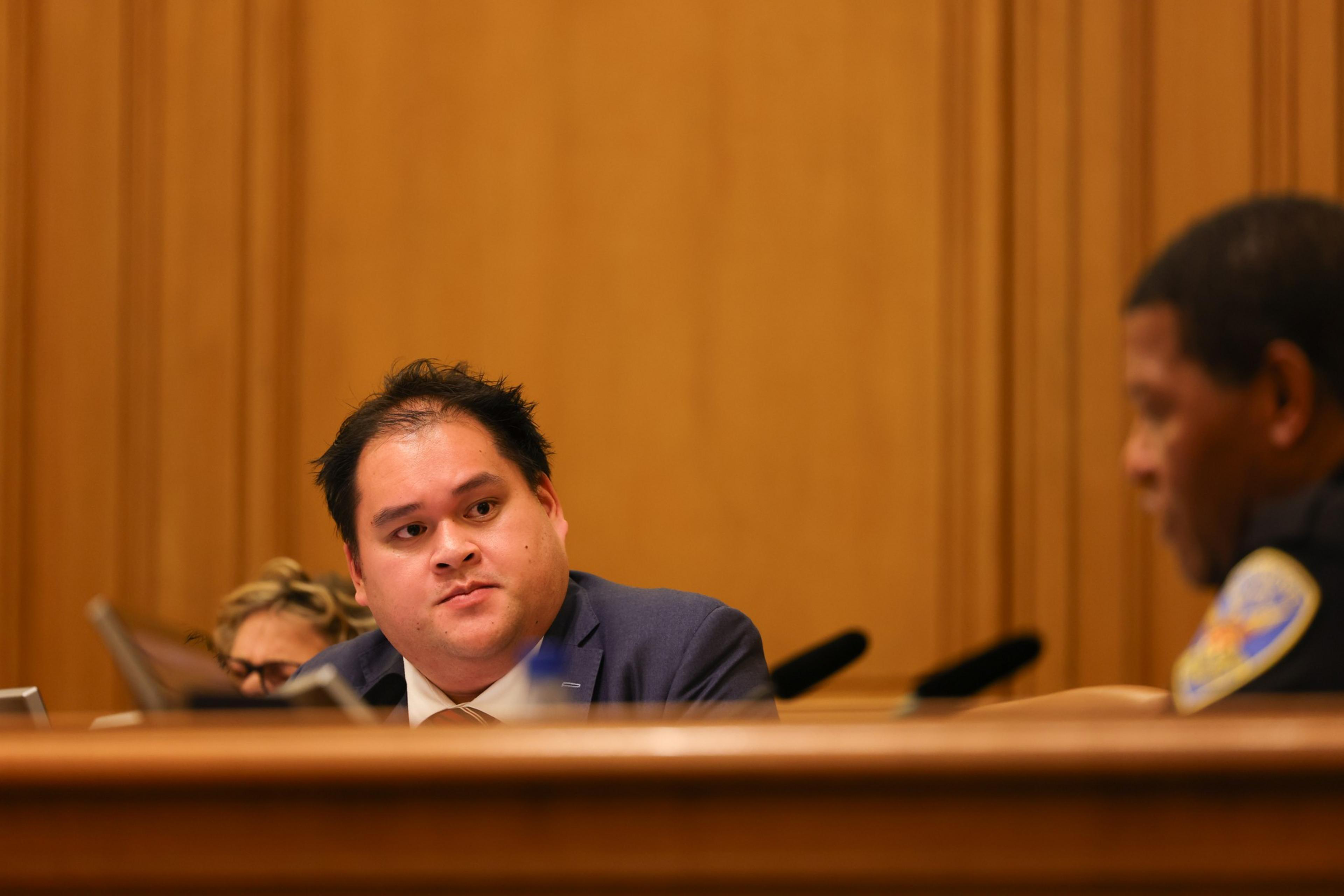 A commissioner at a meeting.