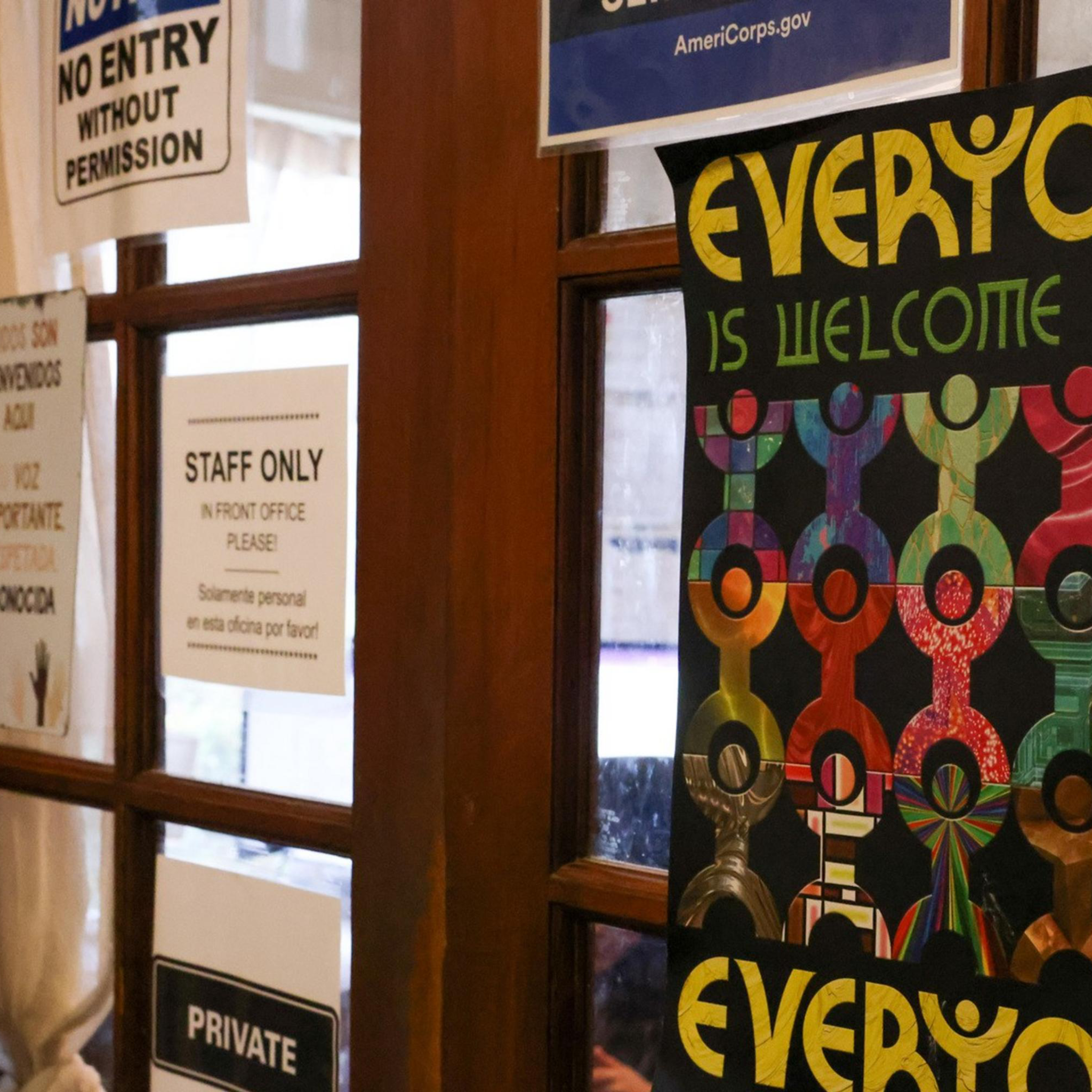 A welcoming sign hangs on the door to the staff office at the Huckleberry House, a 24-hour crisis service and emergency shelter for high-need teenagers, in San Francisco on Thursday, Feb. 6, 2025. The Trump administration's payment freeze and other actions