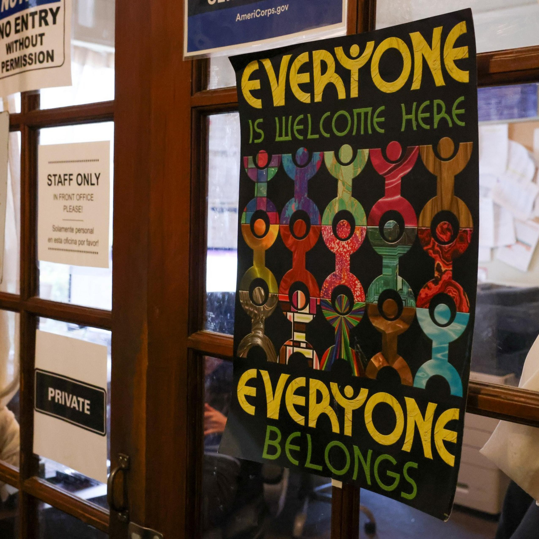 A welcoming sign hangs on the door to the staff office at the Huckleberry House, a 24-hour crisis service and emergency shelter for high-need teenagers, in San Francisco on Thursday, Feb. 6, 2025. The Trump administration's payment freeze and other actions