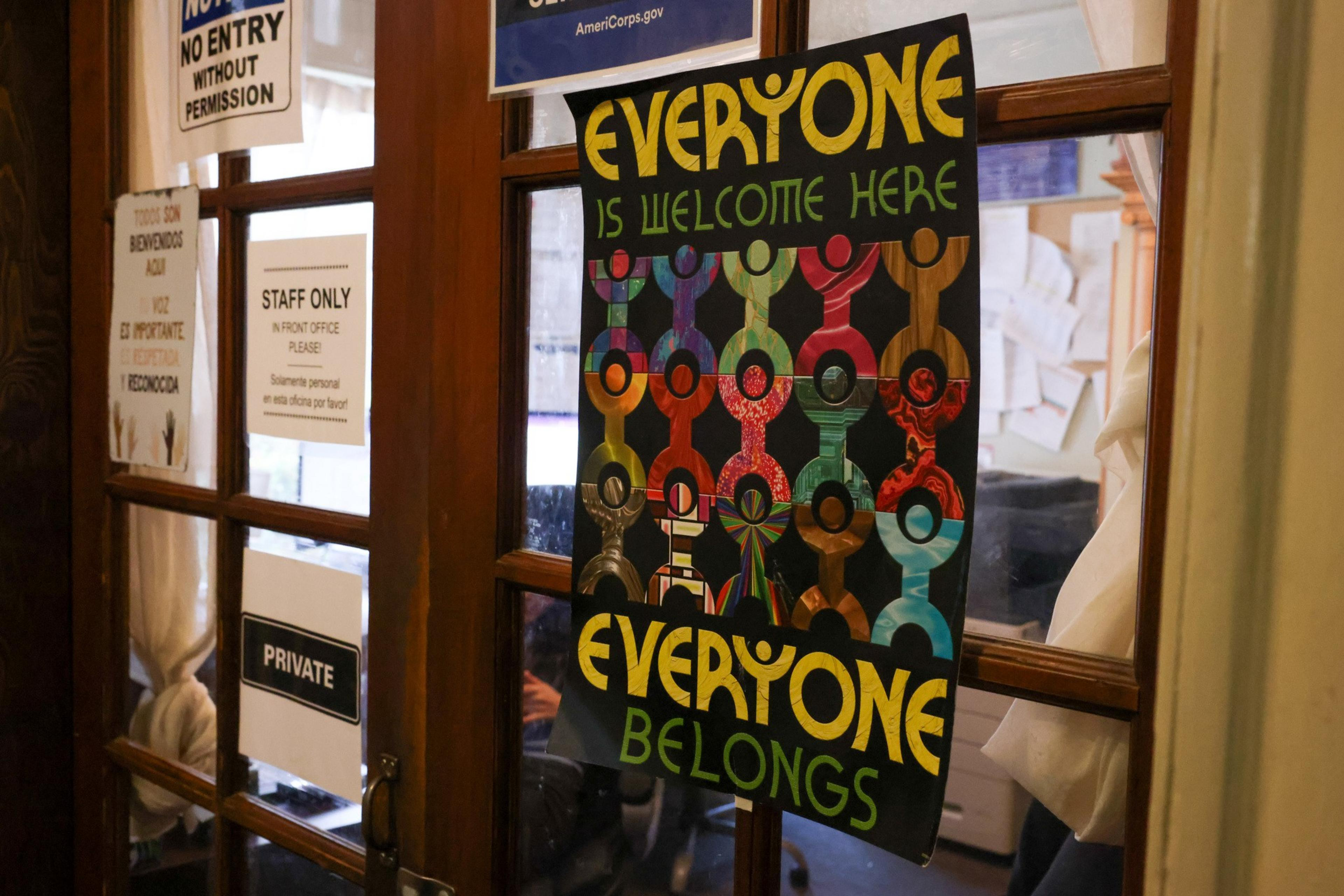 A welcoming sign hangs on the door to the staff office at the Huckleberry House, a 24-hour crisis service and emergency shelter for high-need teenagers, in San Francisco on Thursday, Feb. 6, 2025. The Trump administration's payment freeze and other actions