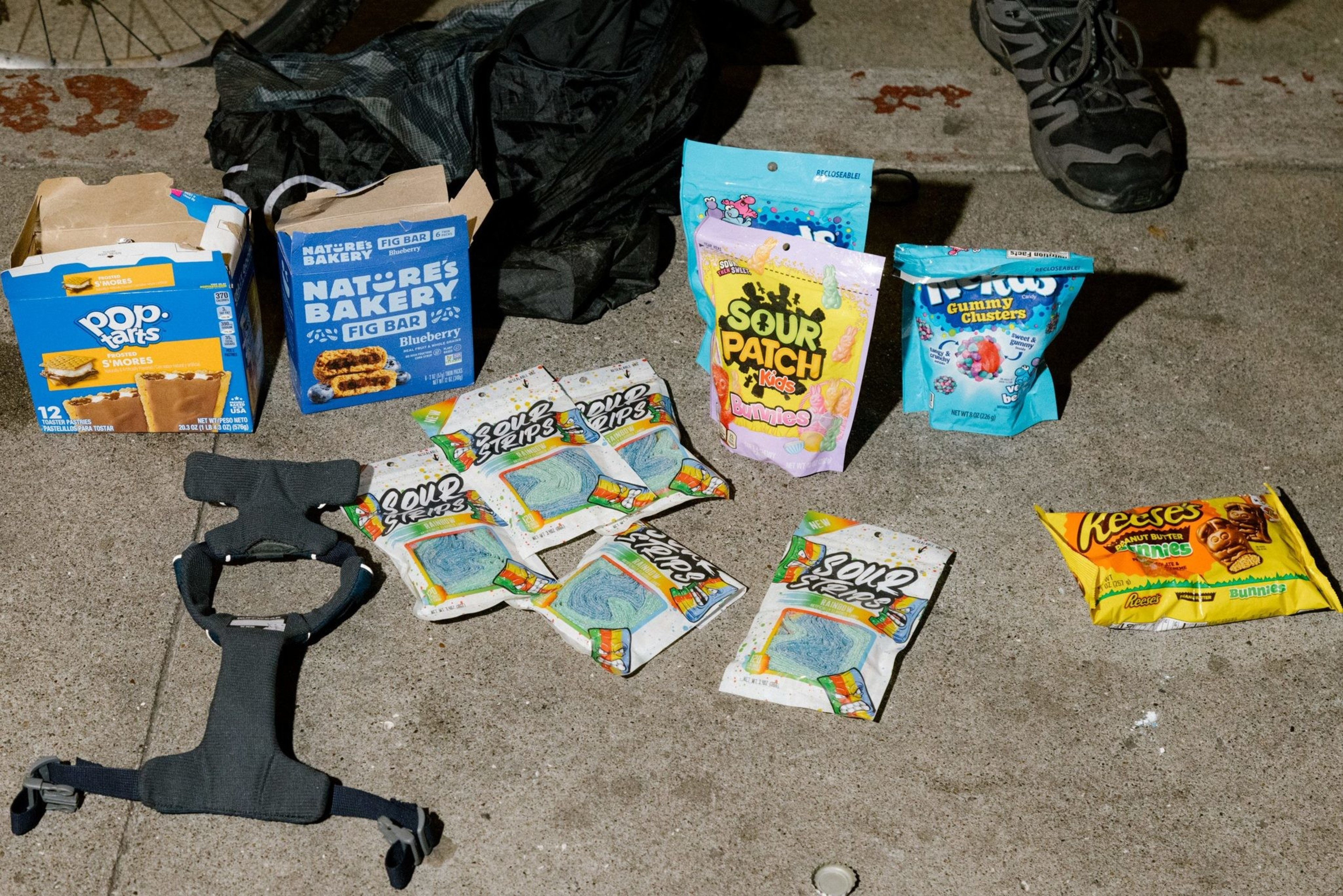 Candy on display on a sidewalk.