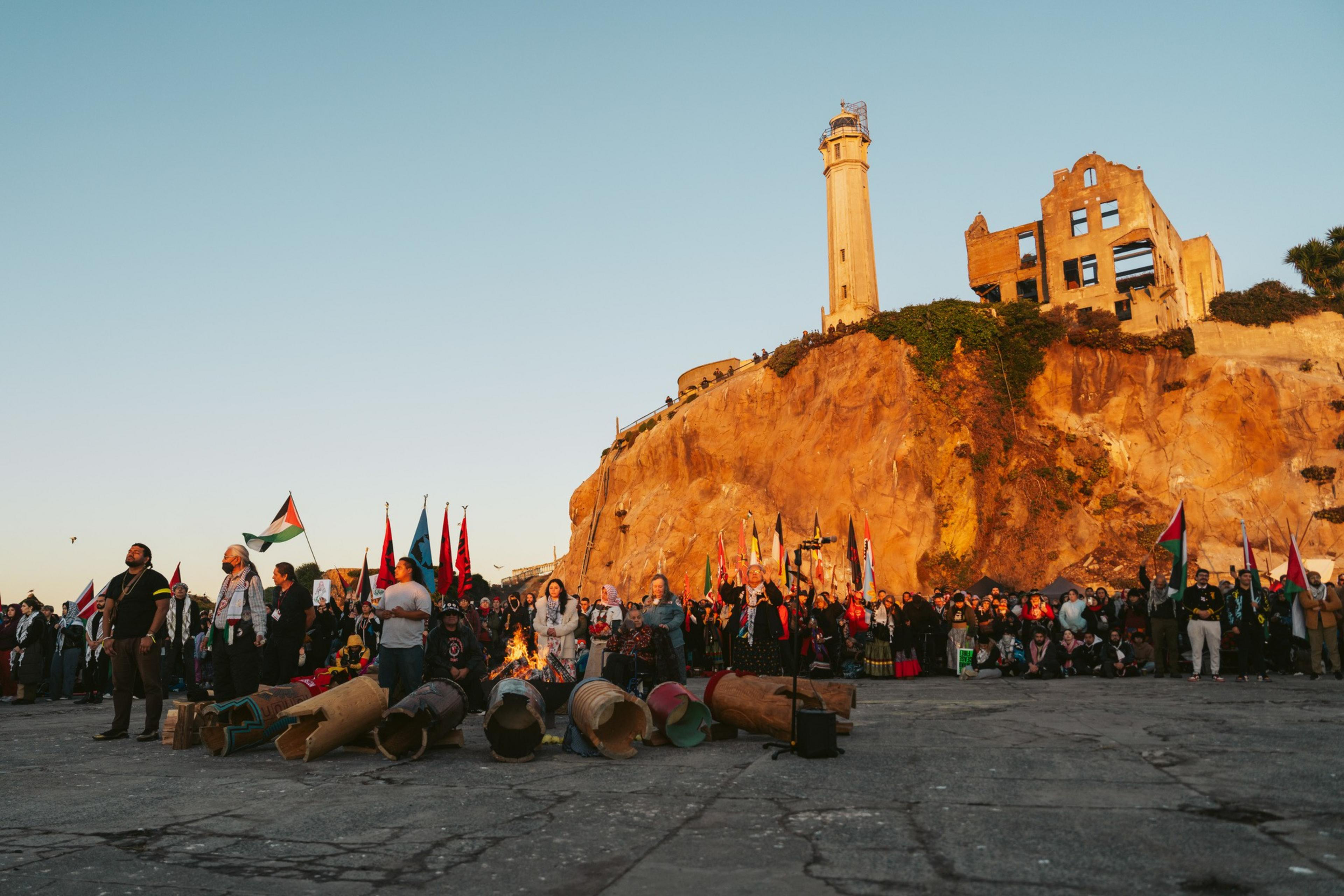 A crowd gathered beneath the ruins of Alcatraz State Prison.