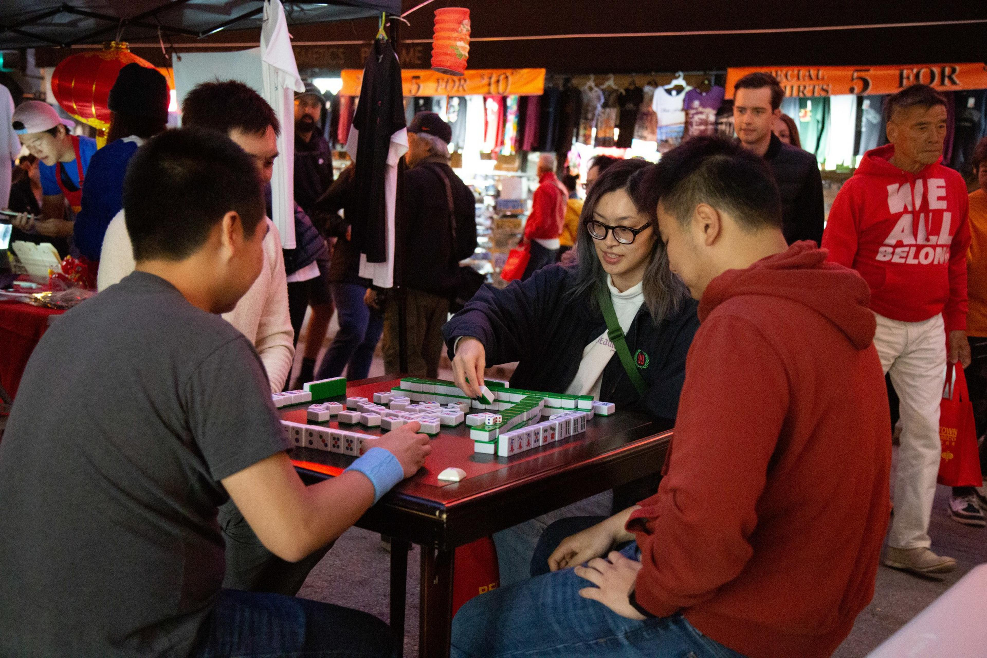 Visitors play mahjong at the Chinatown Night Market event.