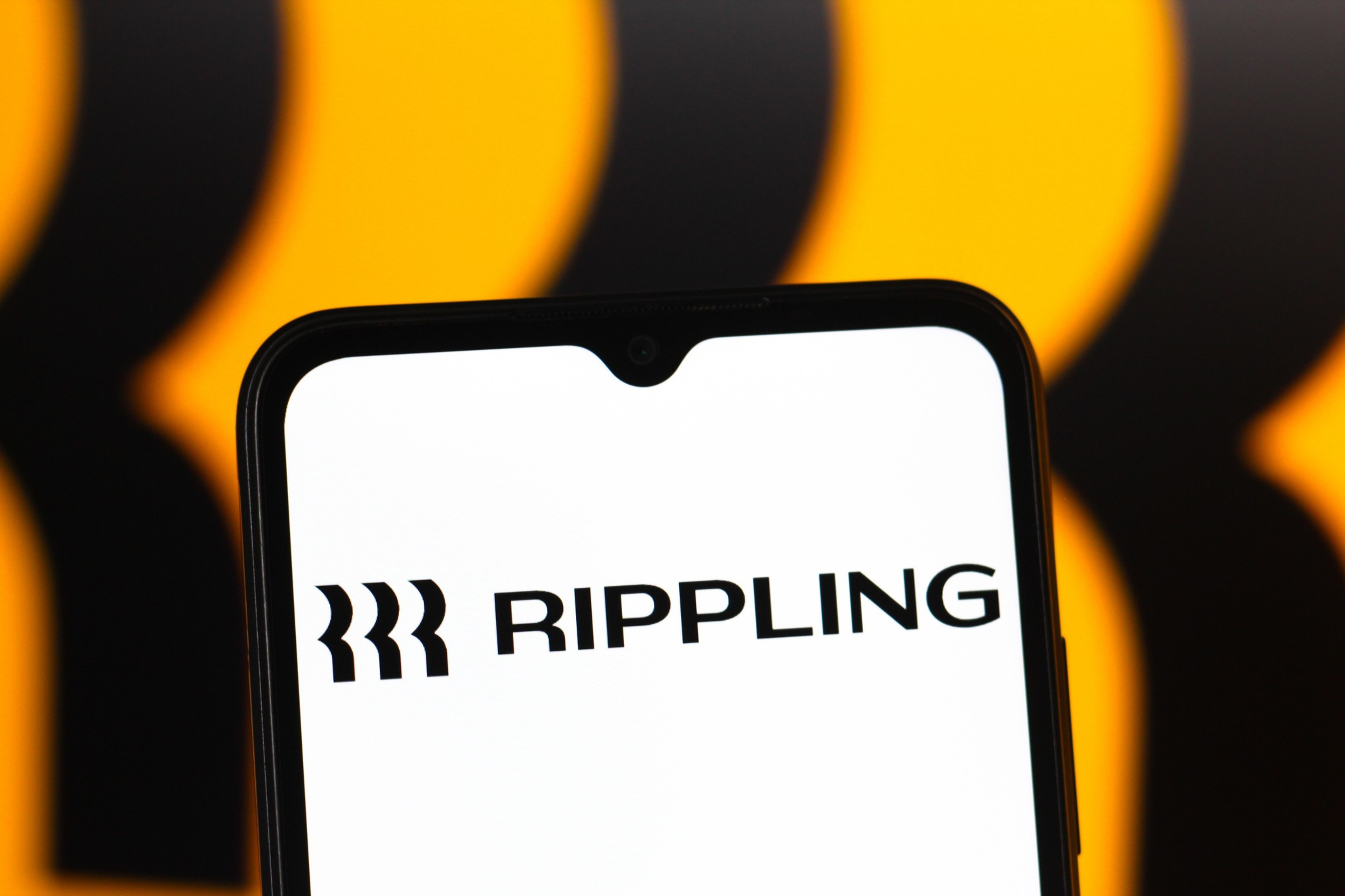 In this photo illustration, the Rippling logo is seen