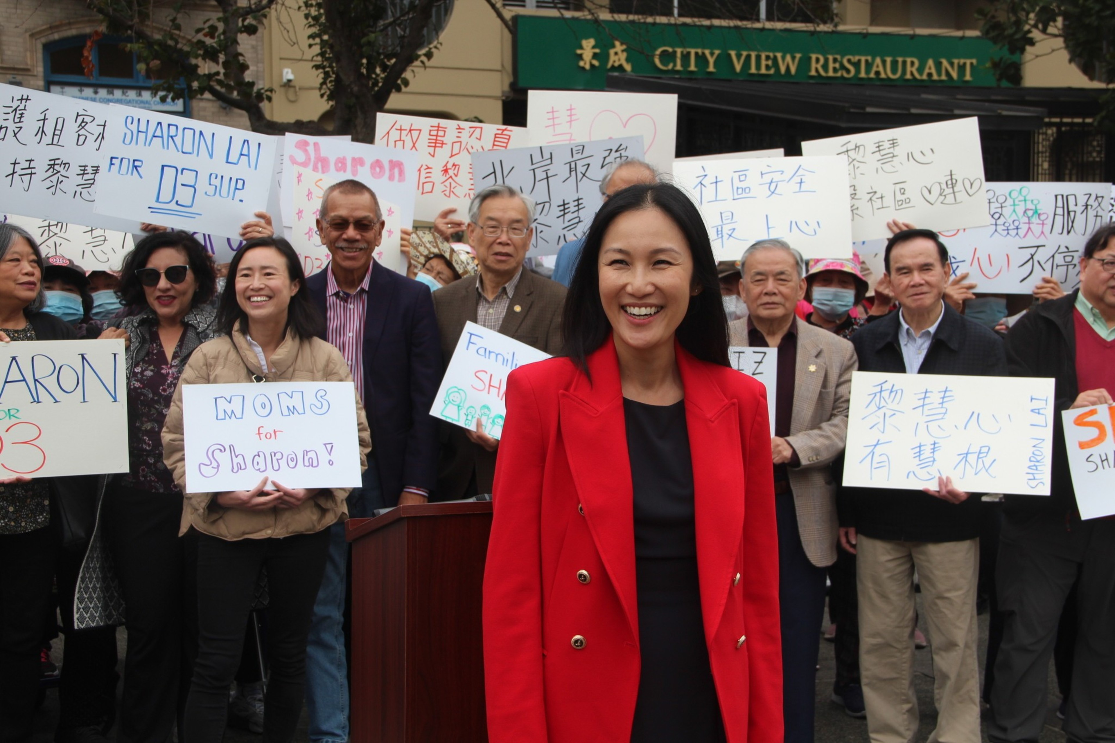 A woman holds a sign at a protest.