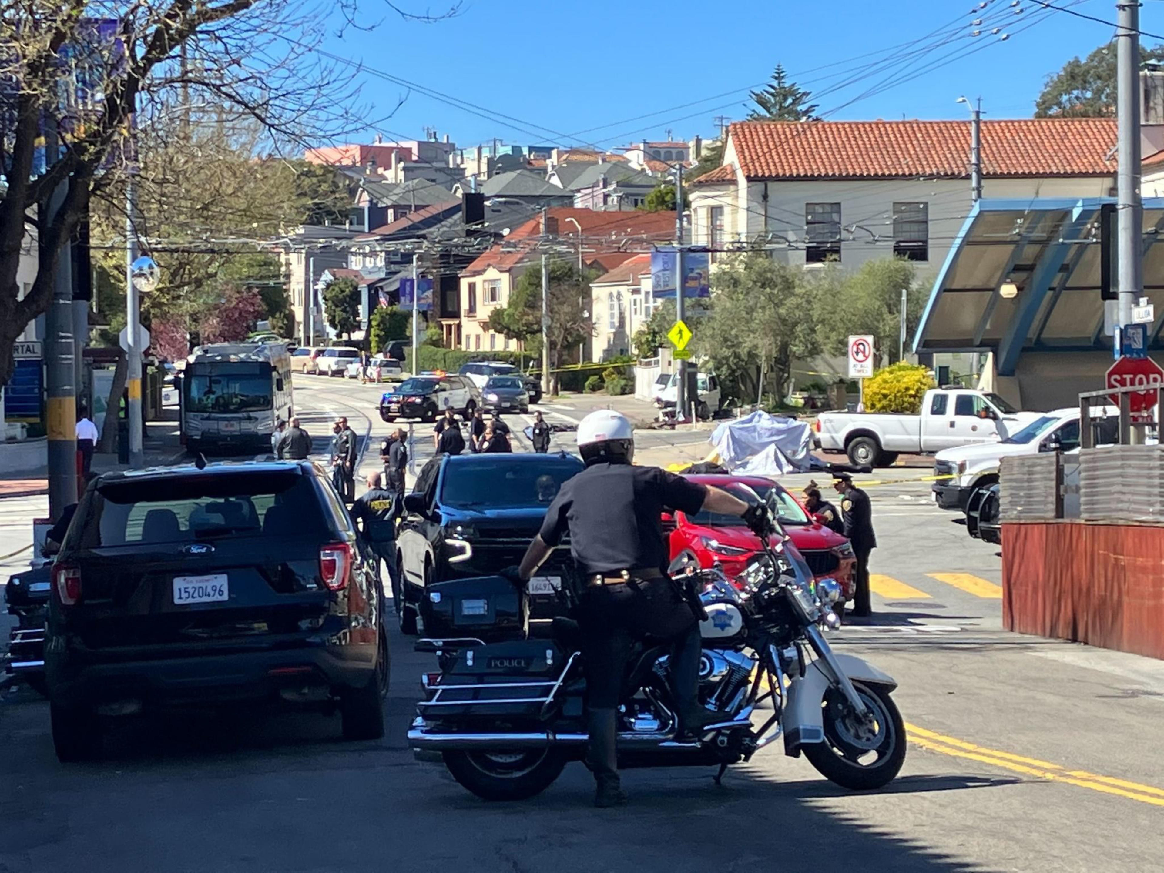 Police cordon off the area of a fatal collision which killed a child and adult while injuring three others including the driver near Ulloa Street and Lenox Way.