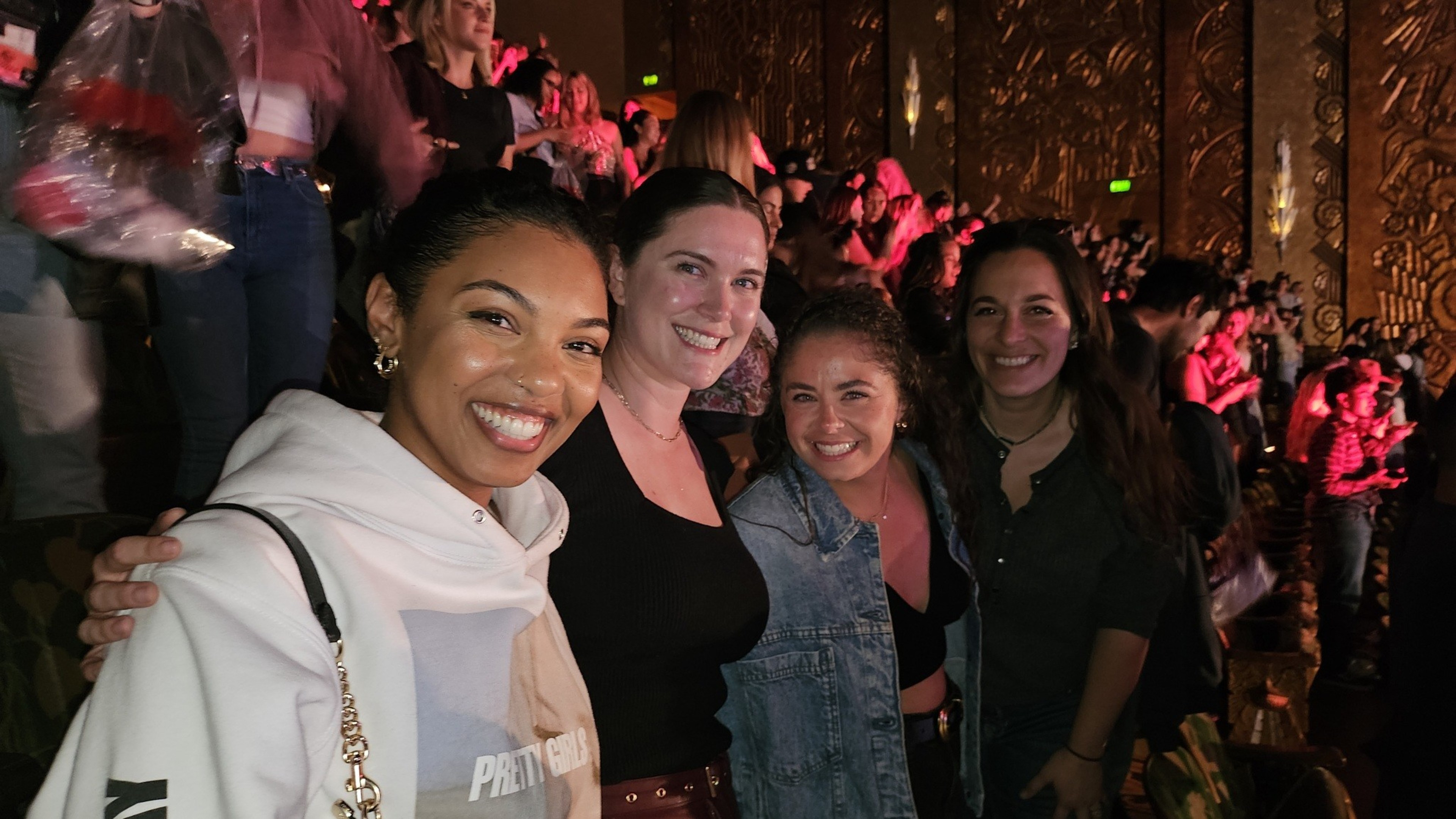 Four women friends pose in the balcony of the Paramount Theater in Oakland after a show.