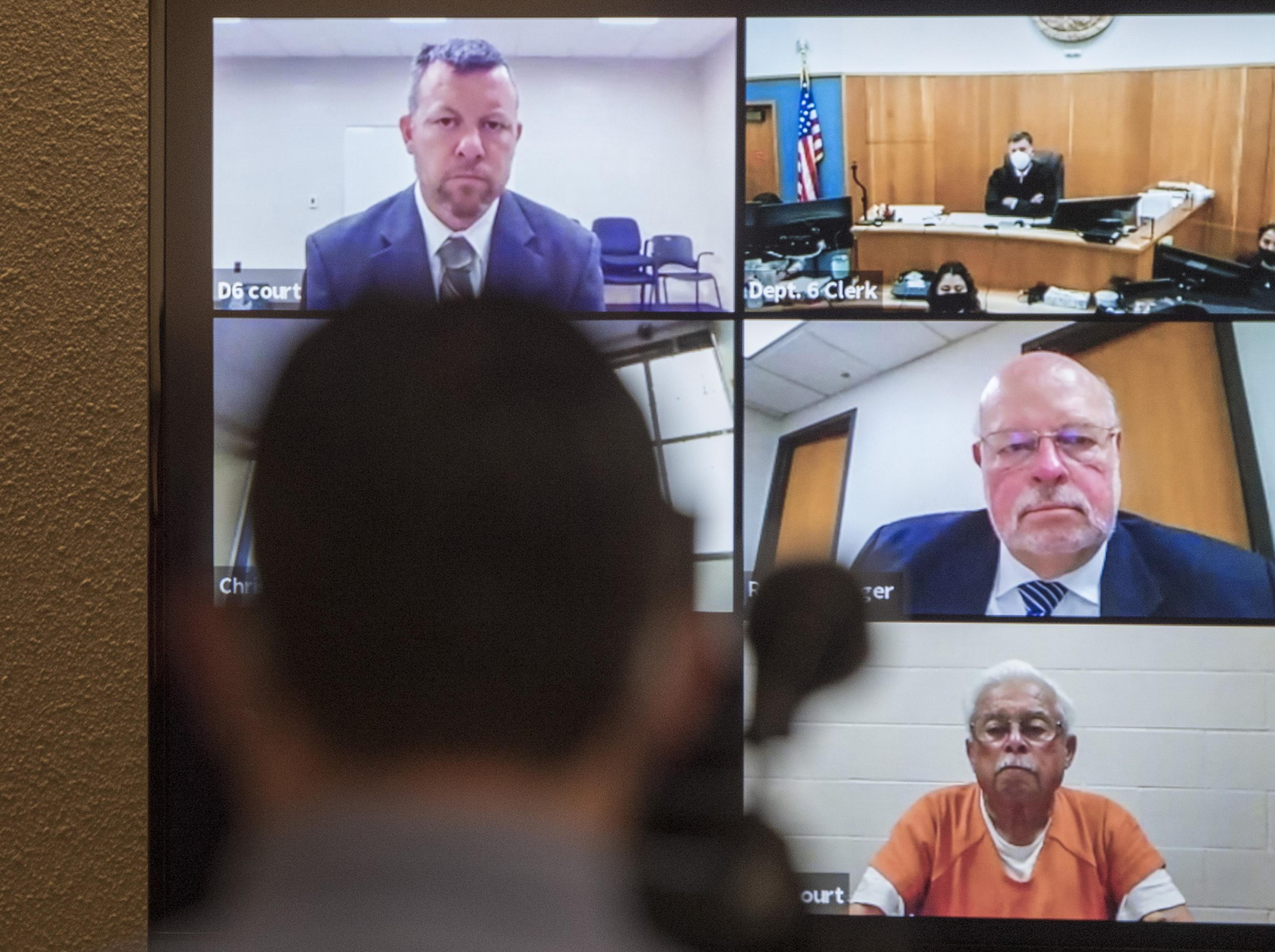 A video screen shows five boxes with individuals staring into the camera