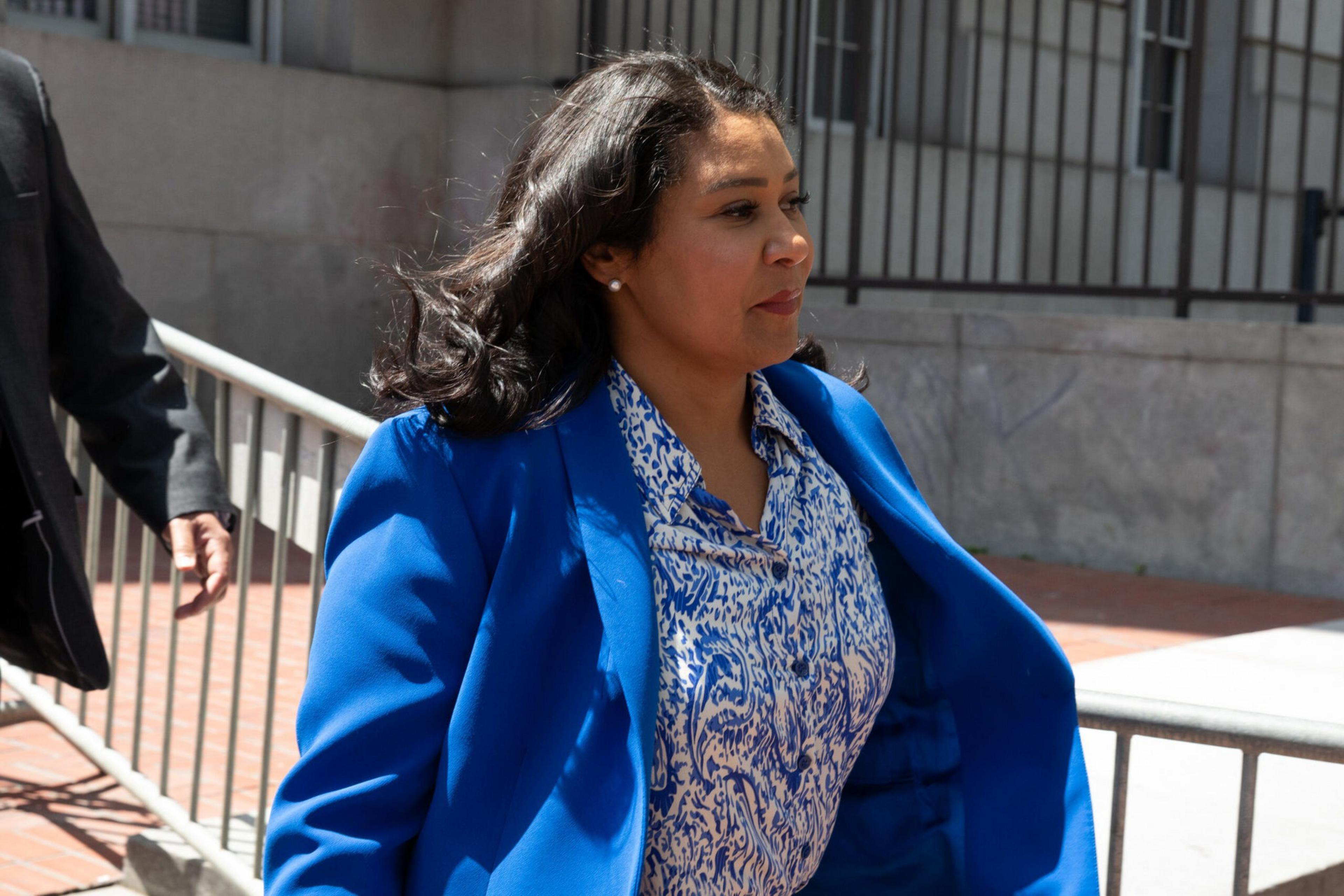 Mayor London Breed walks in UN Plaza