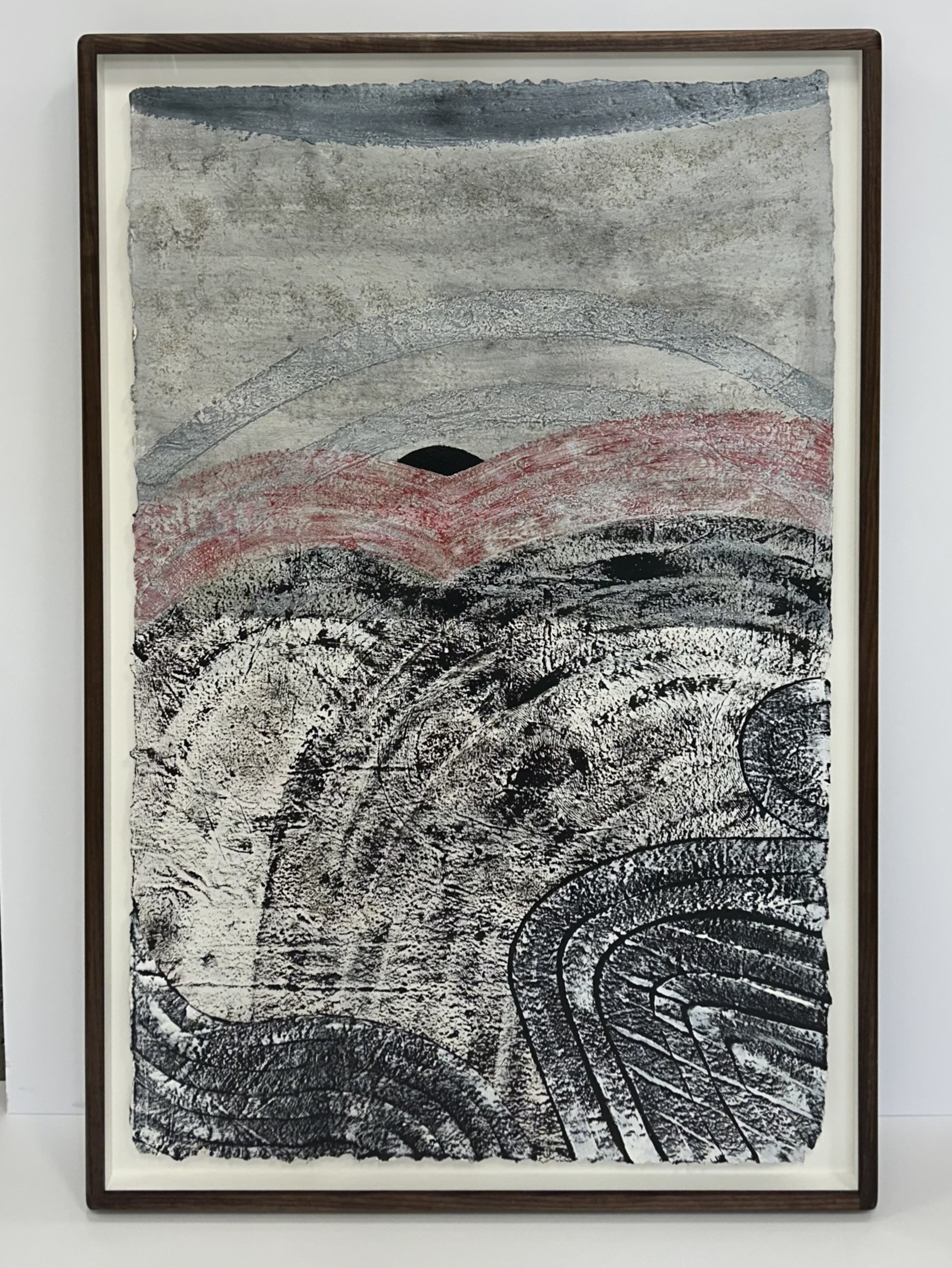 Abstract textured painting features layered curves and waves in black, white, gray, and muted red, framed in a simple dark wood frame.