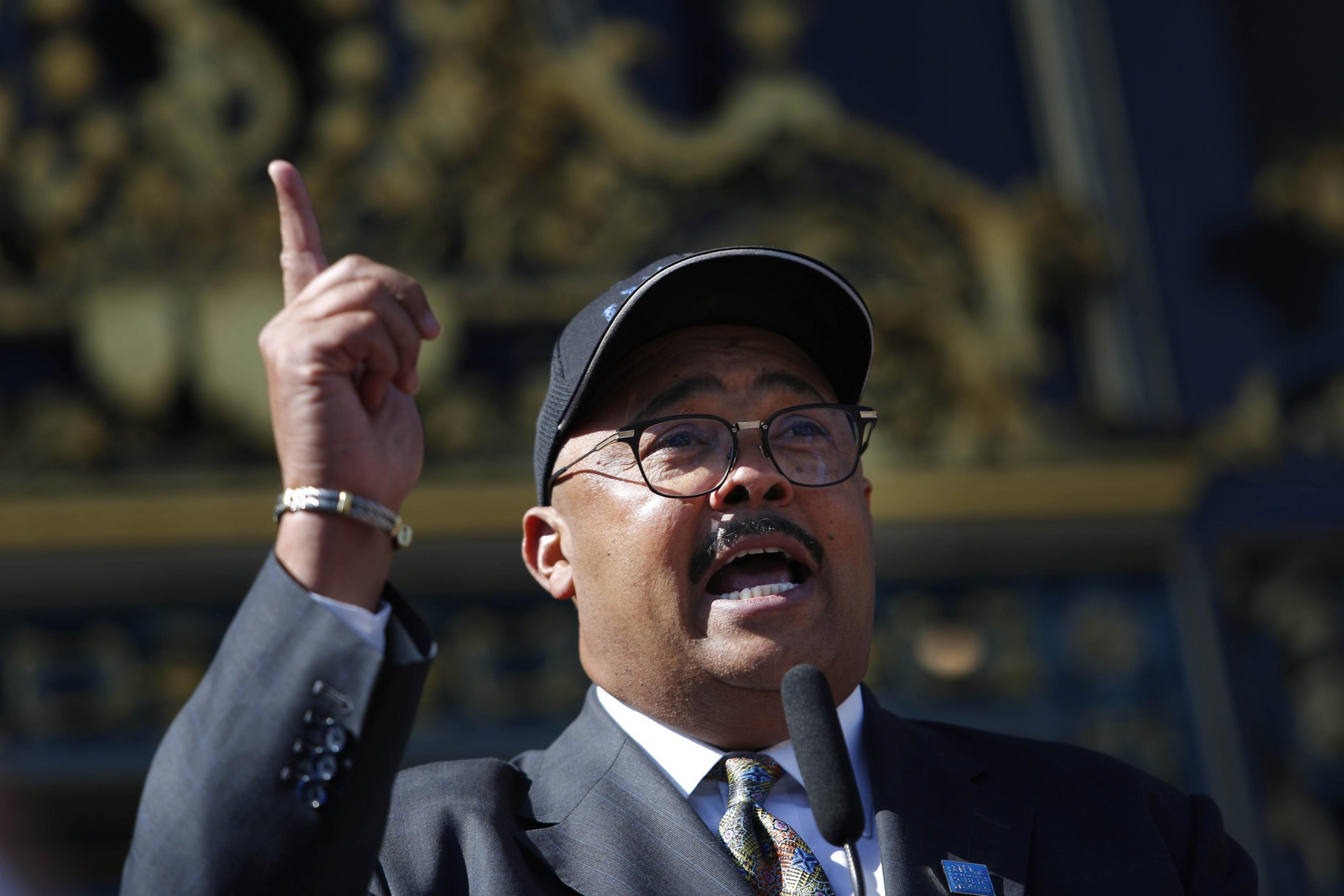 A man holds his hand up in the air