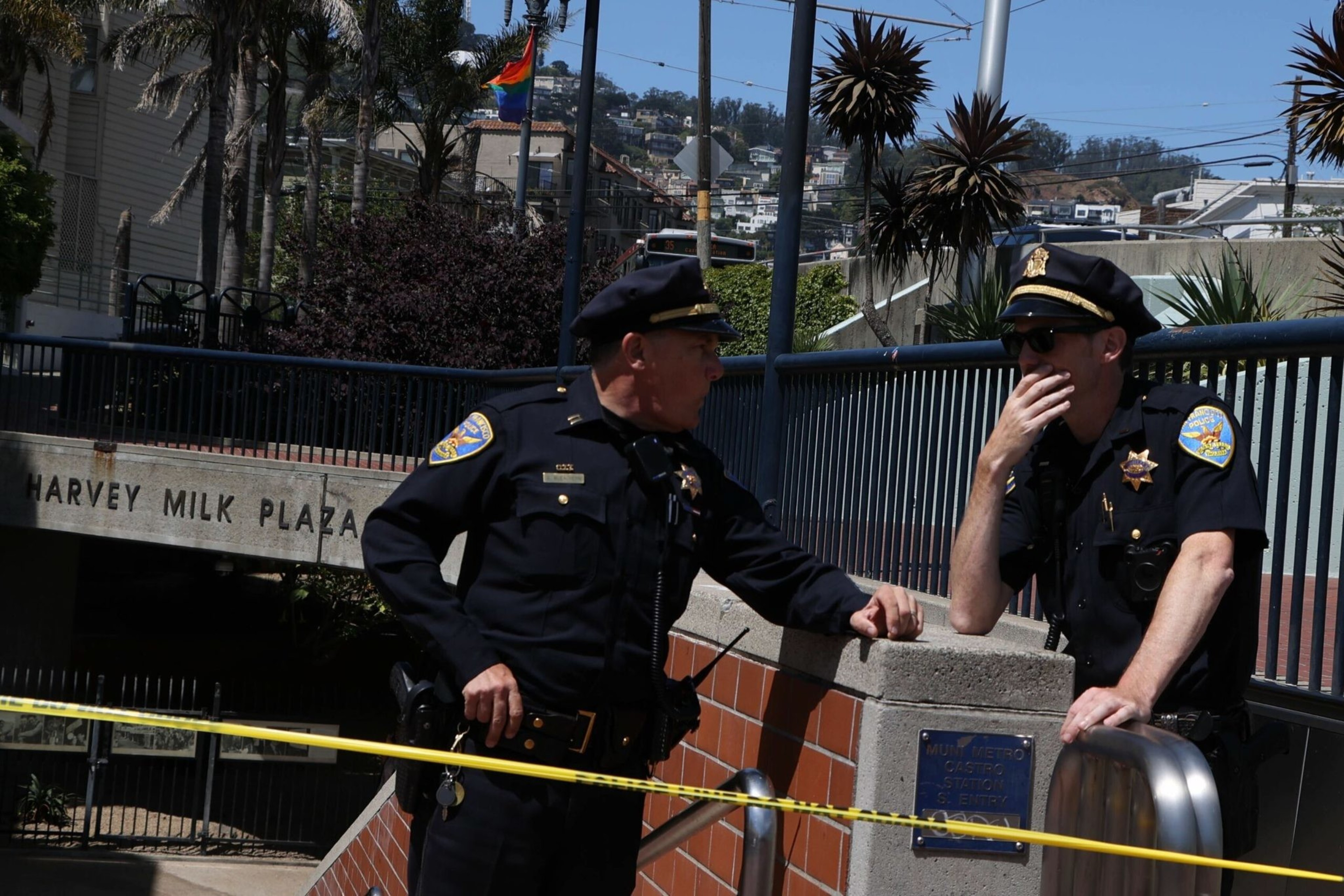 San Francisco Police Officers talk outside the Castro Muni station at Harvey Milk Plaza on Wednesday, June 22, 2022. Following a shooting on a Muni train, SFPD has confirmed that one victim has died and the second sustained non-life threatening injuries. | Camille Cohen/The Standard
