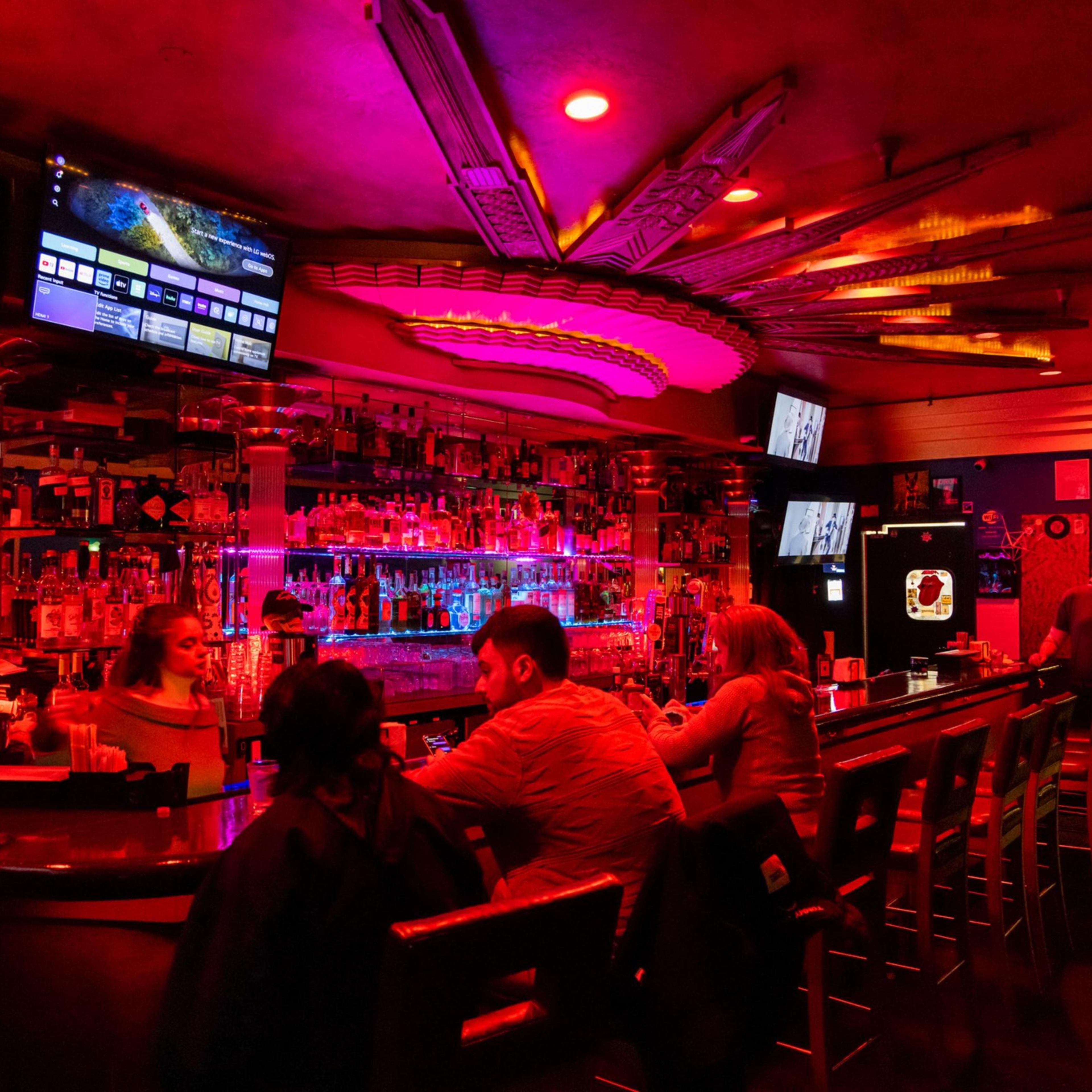 A photograph of a crowded bar.