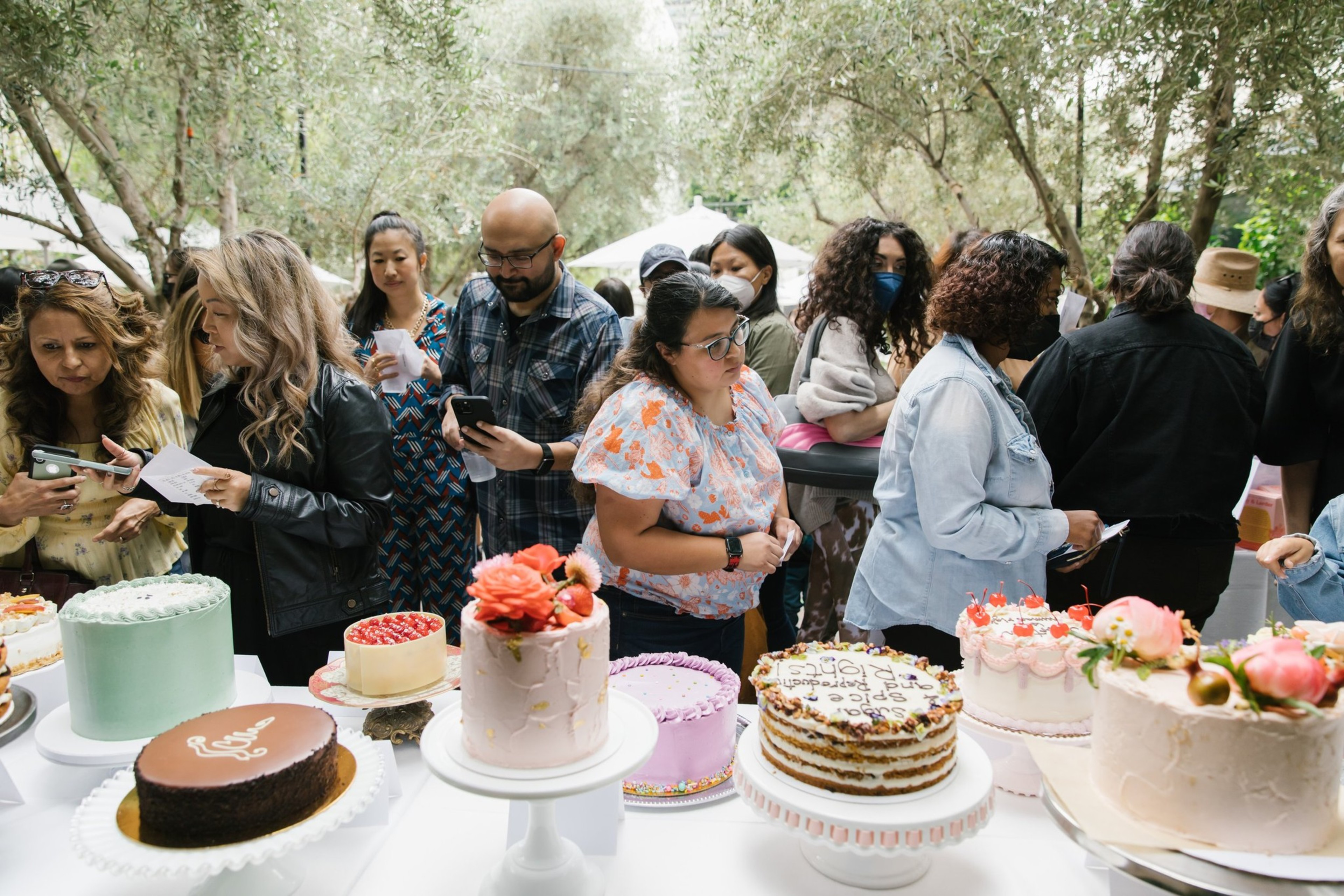 People enjoying a Cake for Choice event