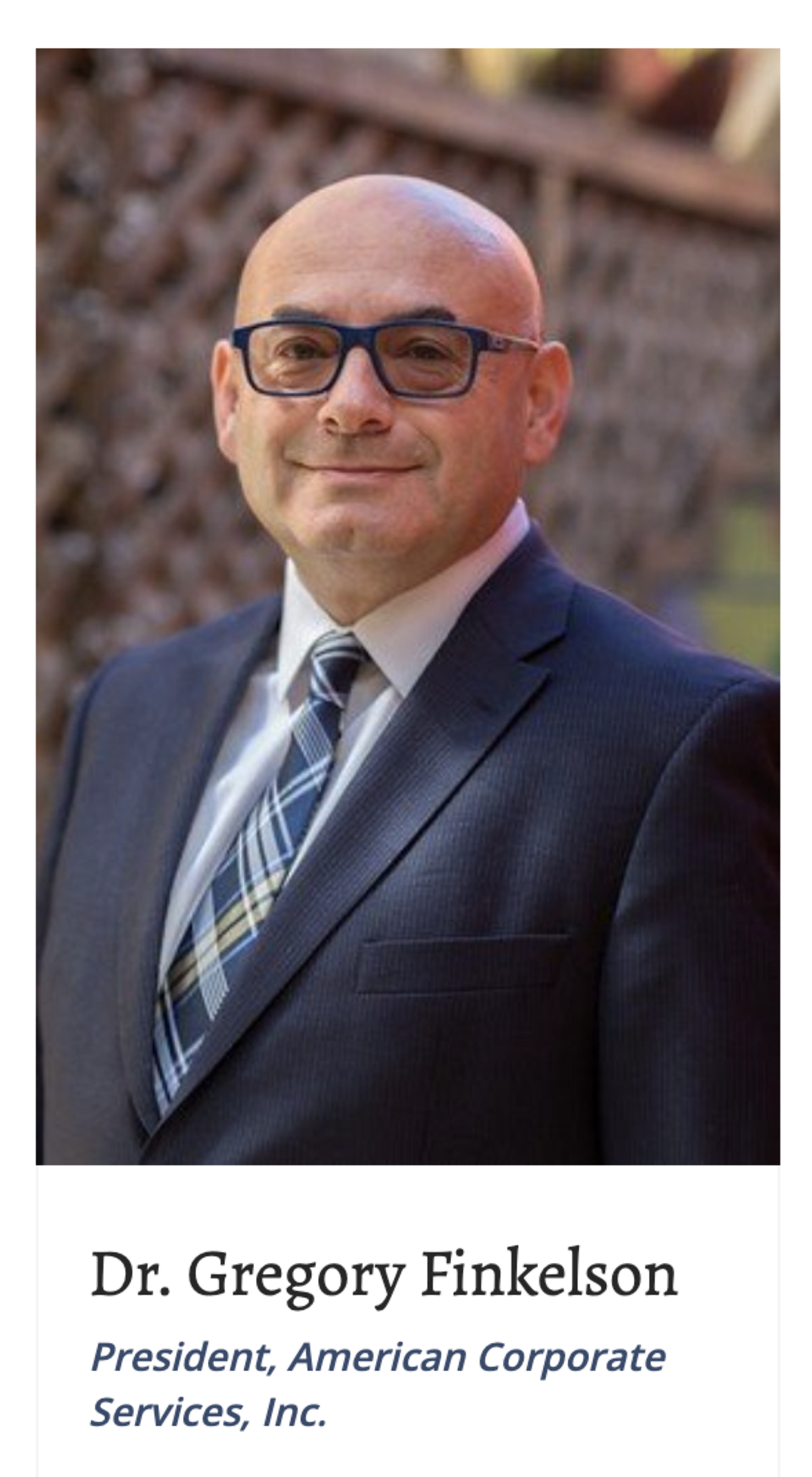 A man's photo appears on his business' website.