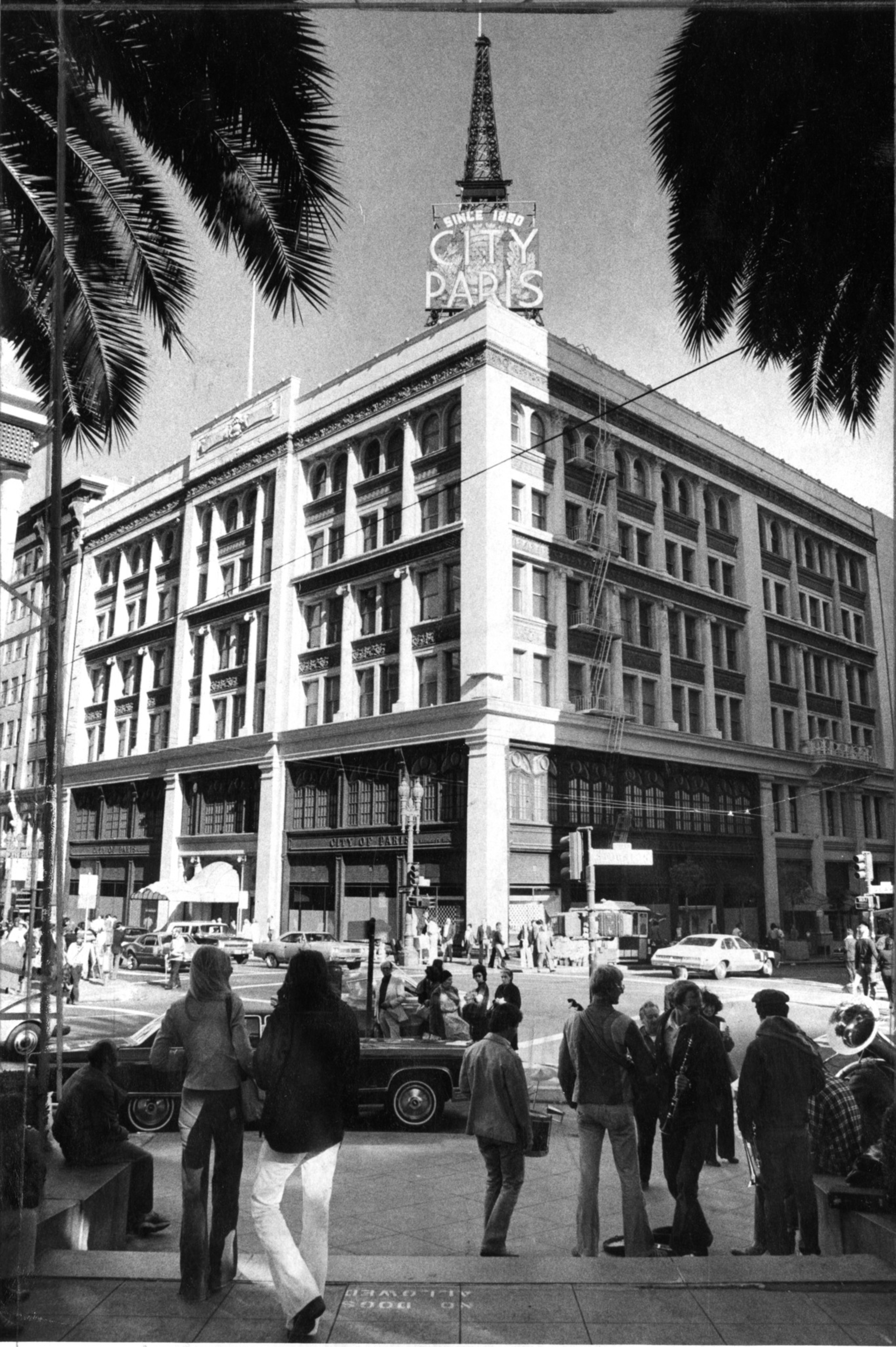 People walking in Union Square with buildings in the background.