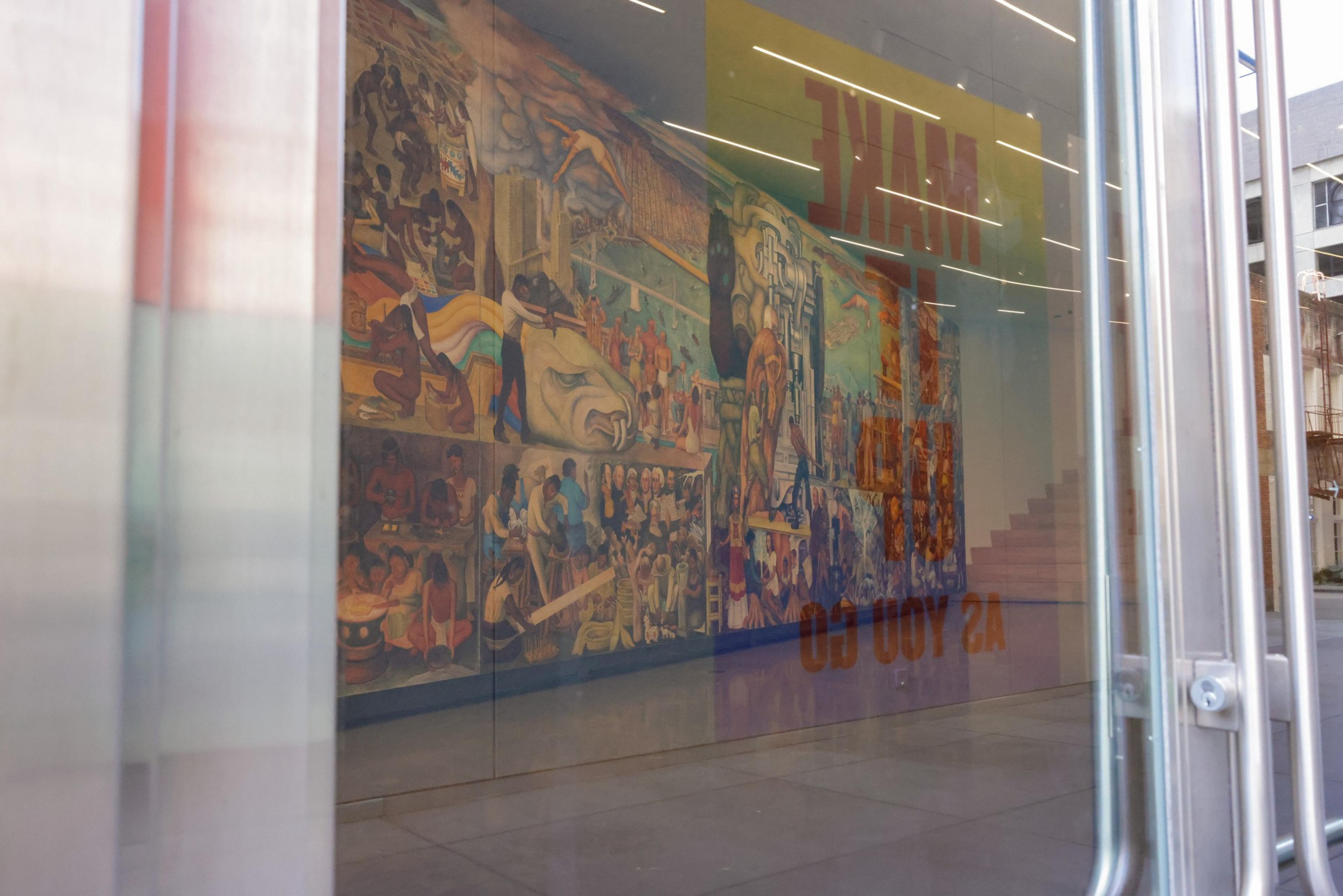 A mural is barely visible behind doors. 
