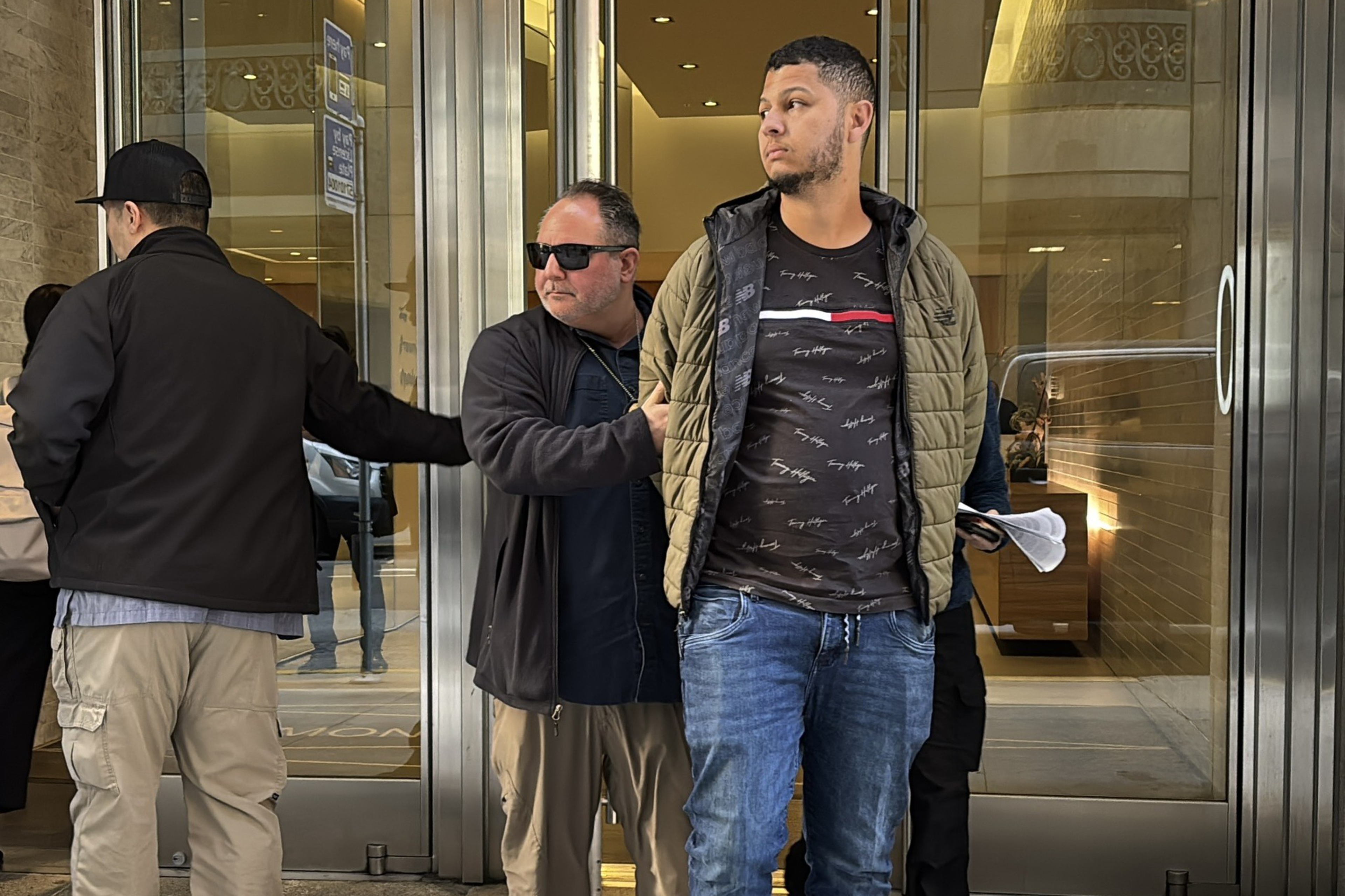 ICE agent detains immigrant