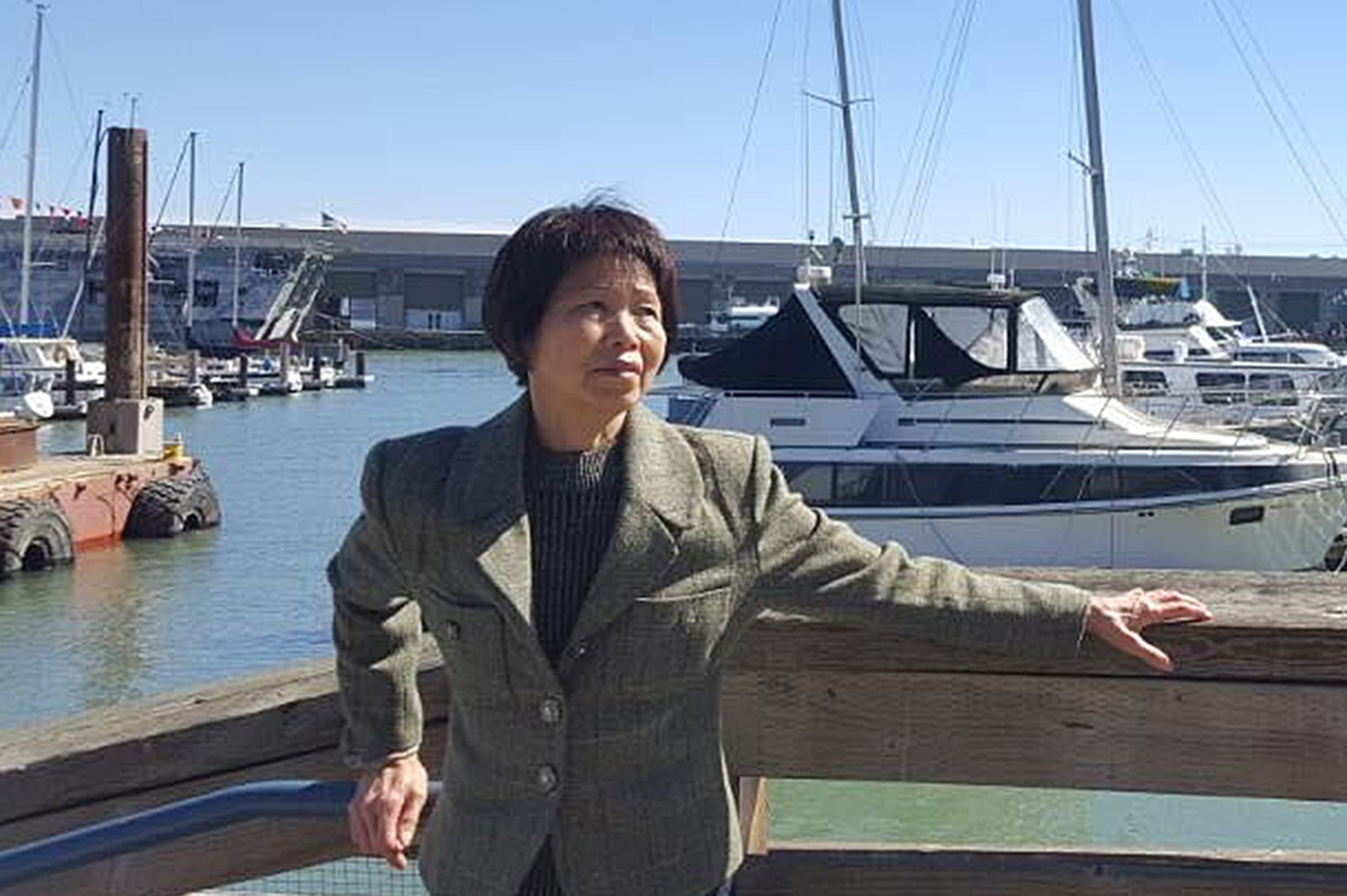 A person stands on a pier