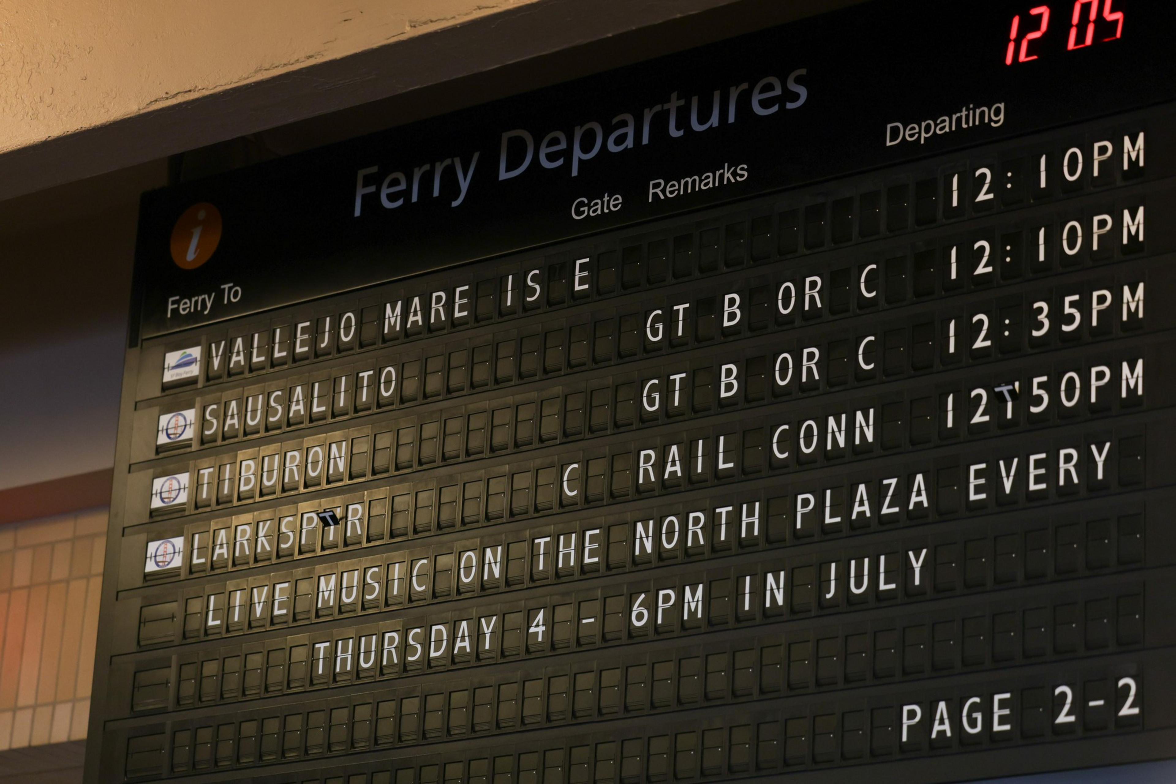 Ferry departures board lists trips to Vallejo Mare Island, Sausalito, Tiburon, and Larkspur with departure times from 12:10 PM to 12:50 PM.