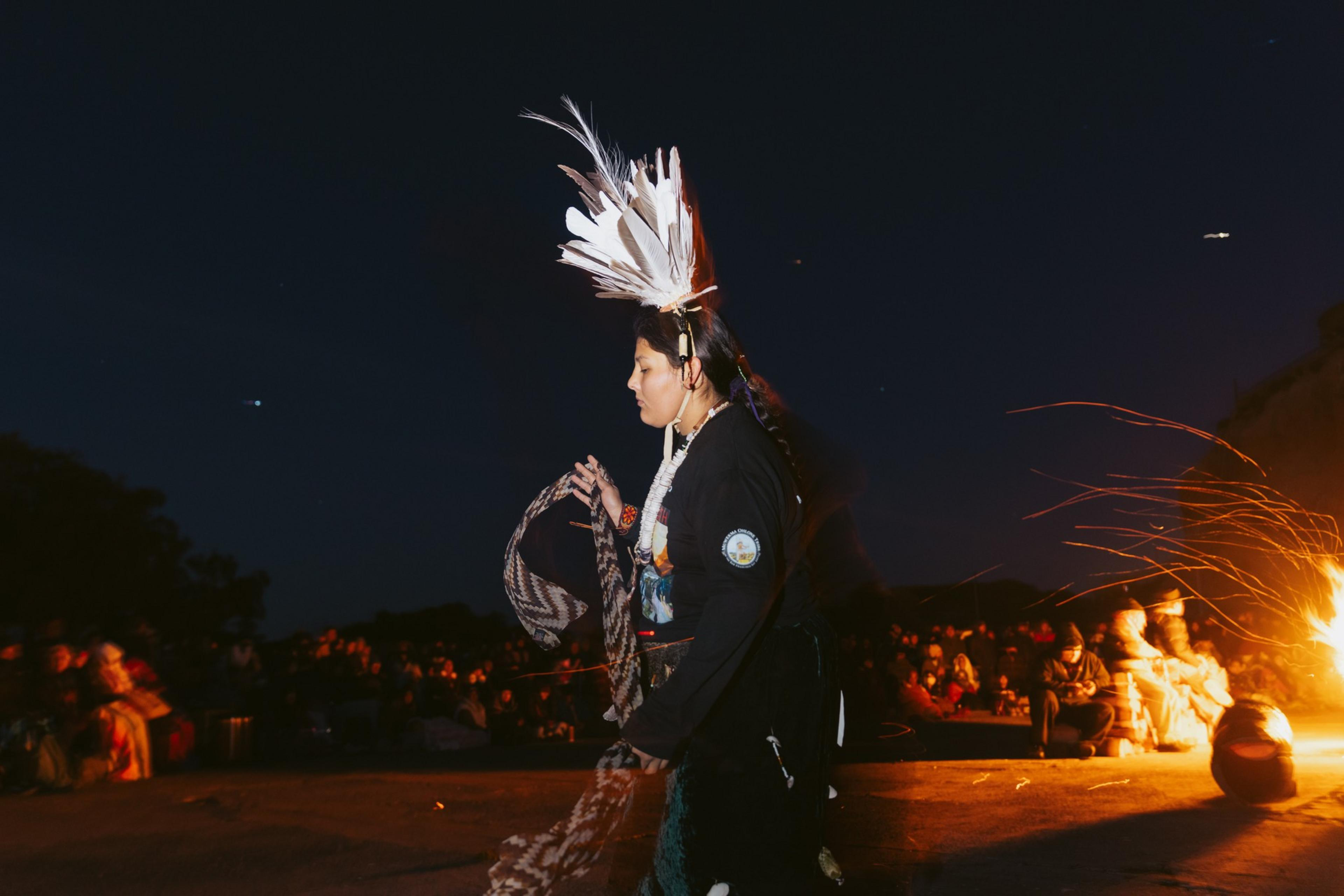 A Muwekma Ohlone dancer dances during the Sunrise Ceremony on Alcatraz Island on Thursday, Nov. 28, 2024.